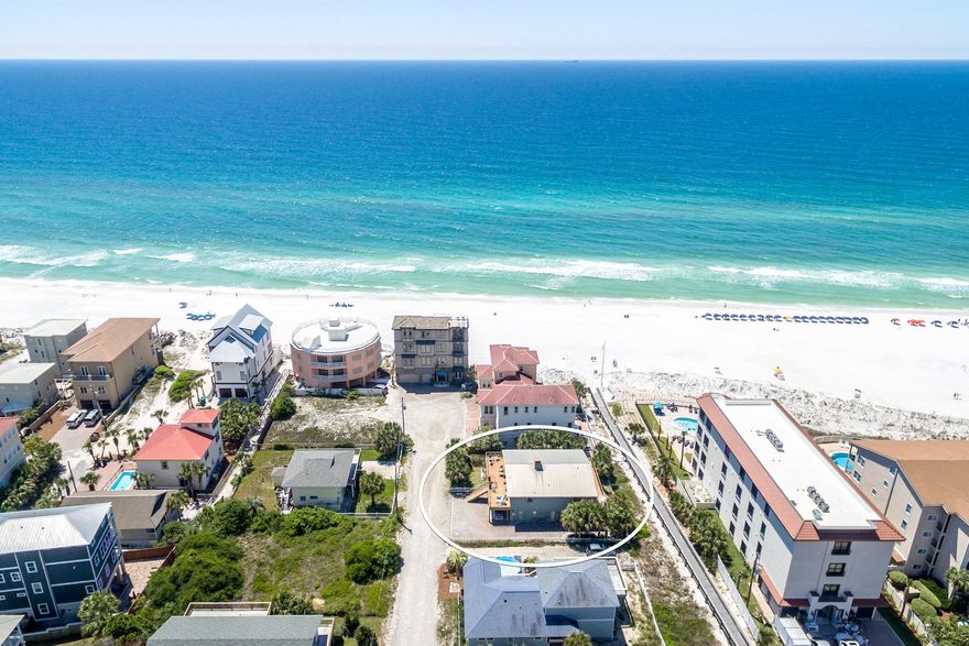 Owner financing available! Call for terms. Check out the virtual tour in the 'Photos' tab! Situated in the X flood zone means NO flood insurance required! You will cherish owning this perfect Beach House steps to the white sands and Gulf. South of Scenic Gulf Drive with your own private gate access to the beach walkover. Over 1,500 SqFt of both covered and open wrap around decks boasting sensational unobstructed Gulf views. A huge gourmet kitchen, wet bar, dining and living room with two Master suites and a Bunk Room occupy the main level. The ground level boasts another complete home with full kitchen, dining and living room, four additional guest bedrooms and three full baths. This home currently sleeps 20 people comfortably and has excellent investment potential. Sold fully furnished.