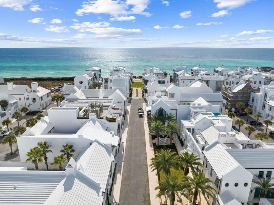 Located south of 30-A, this prime Alys Beach location on South Charles Street offers easy access to the Beach Club and Gulf Green. Designed by Dunham Architecture and Urban Design, this welcoming courtyard home offers 4 bedrooms with 4 full bath and 2 half-bath. This never rented residence has been carefully maintained and comes professionally furnished. This premium 40' wide x 80' deep lot offers ample space and design advantages.A spacious front loggia with dramatic signature arch greets you and your guests. Numerous builder upgrades include venetian plastered walls and ceilings, coral shell stone and white oak wide plank flooring. Clean crisp lines with a natural color palette of whites, creams and beiges frame a most comfortable floor plan in this exclusive 30-A beach community. The fully equipped Miele kitchen suite allows ease of use for the gourmet cook while providing an abundance of storage cabinetry and ample pantry. A six burner cooktop with griddle and double oven is accompanied by Miele's refrigerator, freezer, 84 bottle full height wine cooler, dishwasher, warming drawer and built-in coffee machine. Caesarstone countertops with waterfall island, custom Grimes cabinetry in a classic Grey stain with Schuab hardware and Versailles glass backsplash complete your culinary experience. 
The open living and conversation area features an ample seating area, gas fireplace and built in display shelving. Open the double doors to hear the soothing pool fountains.
Ceilings of twelve feet are accompanied by eight foot interior doors that feature an upgraded horizontal oak plank stain with Ashley Norton hardware. Bedrooms feature ensuite bathrooms with Carrara marble countertops, flooring and shower tile with a diamond inlay.
The first floor king bedroom suite opens onto a spacious covered loggia, courtyard and the pool. A practical fourth bedroom with bath and private entry for your guests is easily accessible from the rear Zaguan. An outdoor shower and summer kitchen with 36" Wolf grill & overhead exhaust system are also conveniently located off the Zaguan. Waterline tile and fountain spouts frame the tranquil courtyard pool.  
Arriving to the second level, find a spacious Family & TV Room with vaulted wood ceiling in a beautiful white wash finish with venetian plaster walls. Balcony doors open onto the large 2nd floor outdoor covered loggia area that serves as a third living area. Outdoor appliances by Perlick include an ice machine, beverage center and wine cooler. All are framed by NatureKast outdoor cabinetry in a TeakKast fossil grey. Watch a ball game or enjoy the fireplace with family on the enchanting terrace that overlooks the pool as well as the grand palms of Palmera Park. Even catch a corner view of the gulf!
An interior and exterior gallery connects to the primary king suite with 14 foot vaulted beam ceiling, dual closets and large ensuite bath. Bedroom three also features a vaulted beam ceiling and king bedding.   
Completing your home experience is Control4, iPad house system interface, home water sensor system and two reserved parking spaces. 
