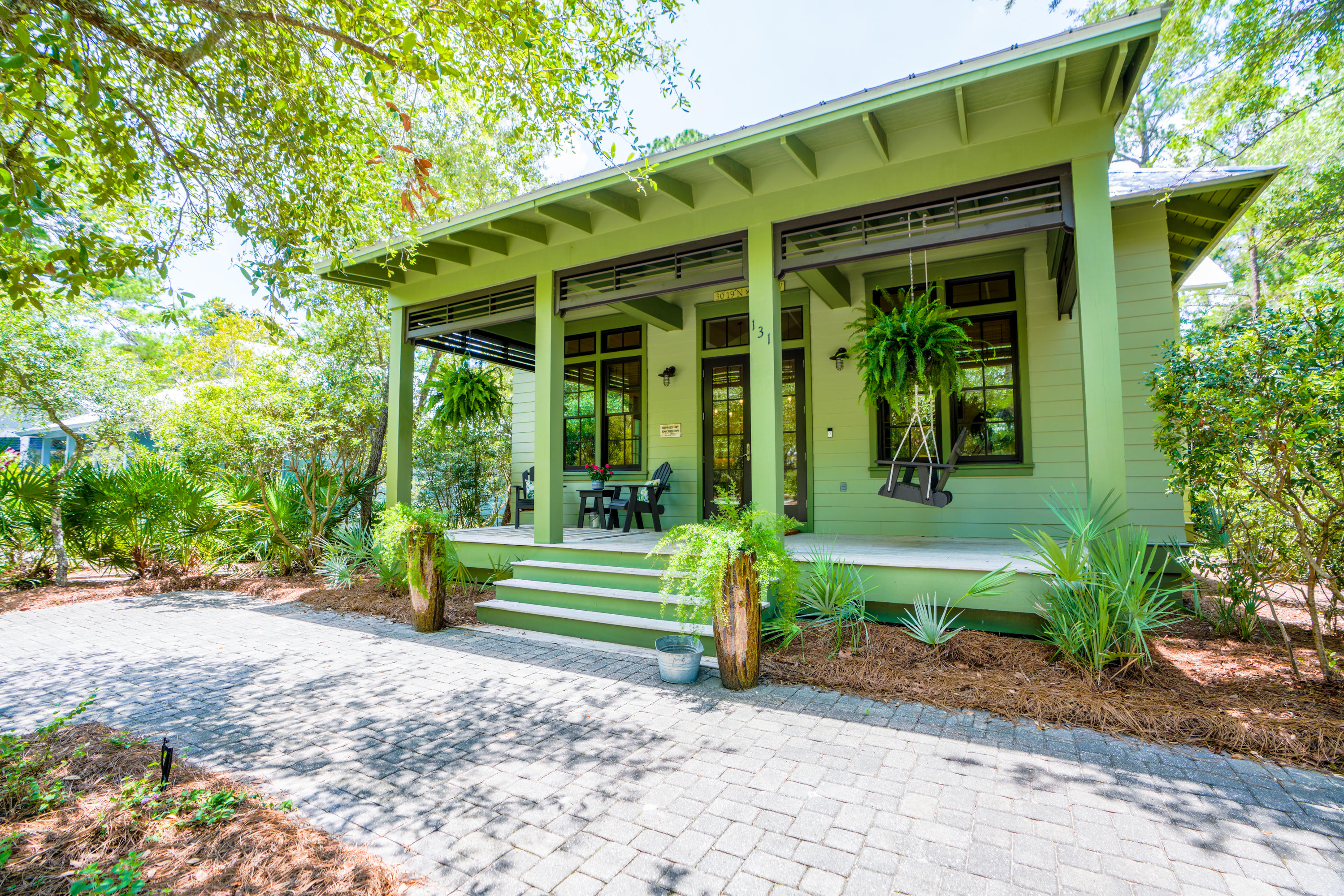 Quintessential beach cottage in The Hammocks at Seagrove, a coastal gated community in the heart of Seagrove. As you enter the property, you'll be drawn to the inviting front porch that spans the entire front of the home. This custom designed and built, and never rented single story home features 3 bedrooms and 3 baths. As you enter the home, you'll immediately recognize the detail and quality construction. Beautifully appointed and maintained, this home exudes coastal charm. From the shiplapped walls to the maple hardwood floors throughout, no detail has been missed. The expansive open floor plan includes a beautifully appointed kitchen with new marble counters, Kitchenaid appliances including ice machine, center island with bar sink and custom white cabinetry. The spacious Master bedroom is located at the rear of the home. Two closets with built-in drawers allow for ample storage. The en suite bath features marble counters, double vanity, garden tub and separate shower. The additional two bedrooms, one with a private bath, the other with a hall/lockout bath, are spacious and again have closets with built-in drawers. On the rear of the home, you'll experience the nature and serene setting that only Old Seagrove can deliver. The expansive 12 ft deep rear screened porch allows for al fresco dining and a large sitting arrangement, perfect for a relaxing evening after a day at the beautiful beaches of the Gulf of Mexico. Just a short stroll from the community, you'll find a beach access at the end of 395. Restaurants and shops in Seaside and Seagrove are easily accessible and walkable. The gated community of The Hammocks at Seagrove is a hidden gem, private and gated with canal access and two renovated pools. PROFESSIONAL PHOTOS COMING SOON. WALK THROUGH VIDEO AVAILABLE.
