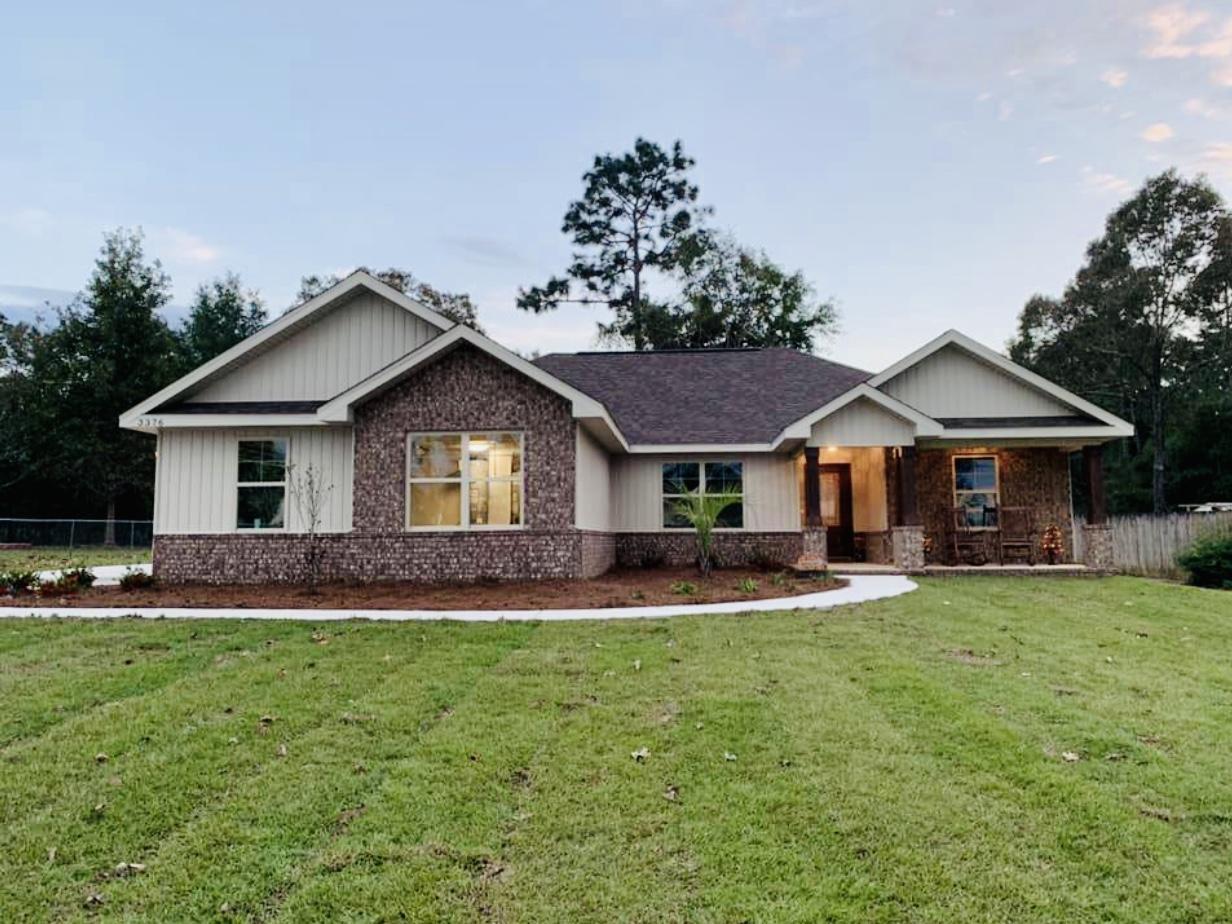 This is a new construction home, photo shows the same floor plan with a different color package. 4 Bedroom, 2 bath, Stainless Steel Appliance Package, Allen and Roth Laminate Flooring in Main Living Areas, Tile in Bathrooms and Laundry Room, Brushed Nickel Lighting.