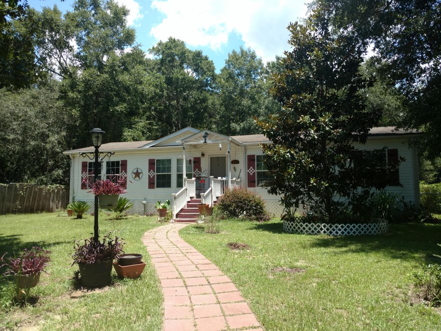 NEW PRICE ON GREAT HOME to Love and Live! Black Creek area, Manufactured Home that is well maintained. Split bedroom plan with nice sized master suite and spacious master bath. Large kitchen with island, cabinets galore and almost new Refrigerator. Freezer, Washer & Dryer in Laundry Room remain with home. Formal Dining room connects to Great room. Flowing floor-plan makes entertaining easy! Relaxing Screen Porch overlooks the Refreshing above-ground pool. Pool is approximately 50'' deep. Completely fenced yard has workshop with power and separate storage shed. Boat Launch at Black Creek Lodge is close by - great fishing on the Rivers, Creek, Bay and Bayous! This is a great permanent home or second home. Take a look - you will be Pleased and Glad you Did!!