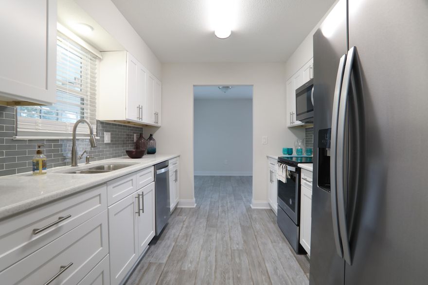 Gorgeous, completely remodeled home In the heart of Destin. 3 bedroom, 2 bath with a Florida room 1,950 Square Feet with brand new kicthen with quartz and Stainless Appliances, updated bathrooms, new flooring, new fans and lights, new interior doors, new garage door, newer ac and newer roof, new sod, Copper wiring and New windows---