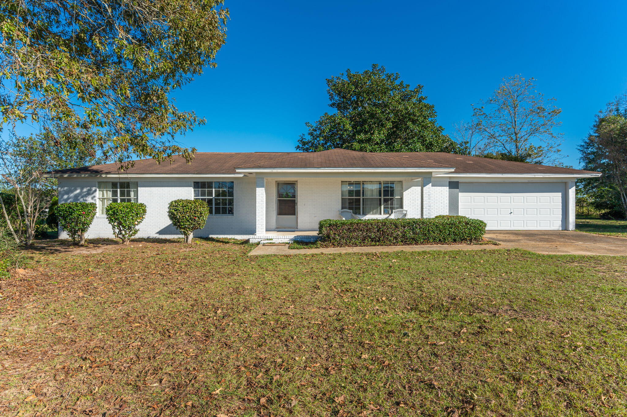 Looking for a little room? This amazing home located just North of Crestview offers EXACTLY what you are looking for! Sitting on 2.95 acres with over 1600 sqft, this inviting home welcomes you with a covered front porch into a large open living room, Home has a kitchen with quality cabinets, lots of storage and great appliances along with a formal dining room and connects to a utility room that is outstanding! Home has been updated to include a brand-new hot water heater, new flooring, new paint and is move in ready minus a few small touches!  Home has a great master with its own master bath and 2 additional bedrooms that are perfect for your family! Offering an open covered back porch that overlooks the acreage and is located just minutes to shopping and easy commute to Eglin AFB