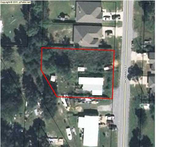 This large buidable lot is READY for YOU! There is a mobile home that is uninhabitable on this property. There is no value being given the mobile home. There are two sheds on the property - the newer one will be sold separately.