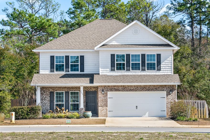 Welcome to your dream home in the heart of the highly desirable Peach Creek community! This meticulously maintained 4-bedroom, 3.5-bathroom brick residence, built in 2020, sits on a fenced and spacious lot, offering the perfect blend of modern elegance and functional design.As you step inside, you'll be greeted by an open floorplan adorned with recently upgraded LVP flooring and a soothing neutral color scheme that complements the contemporary aesthetic. The kitchen is a chef's delight, featuring newly painted cabinets, white subway tiles, and luxurious granite countertops, creating a perfect space for culinary creativity. Adjacent to the family room, a convenient powder bath enhances the functionality of the main living area.The first-floor master suite is a