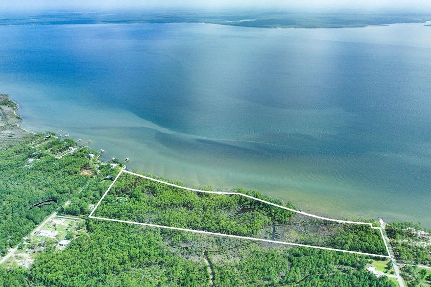 Discover an extraordinary opportunity on the shores of Choctawhatchee Bay. This unparalleled bay front acreage offers unlimited upside for development or the serene privacy of a secluded estate.Conveniently located in world-renowned South Walton, the property is just minutes away from the pristine sugar-white beaches and extraordinary amenities of 30A and Sandestin.Boasting over 2,285 feet of magnificent waterfront on 35.55 acres along Choctawhatchee Bay, this is a truly spectacular parcel like no other. The property is zoned Traditional Neighborhood, allowing for a density of up to 30 units per acre.All structures on property are deemed without value. All information is deemed reliable but not guaranteed, The buyer to verify for their particular use.
