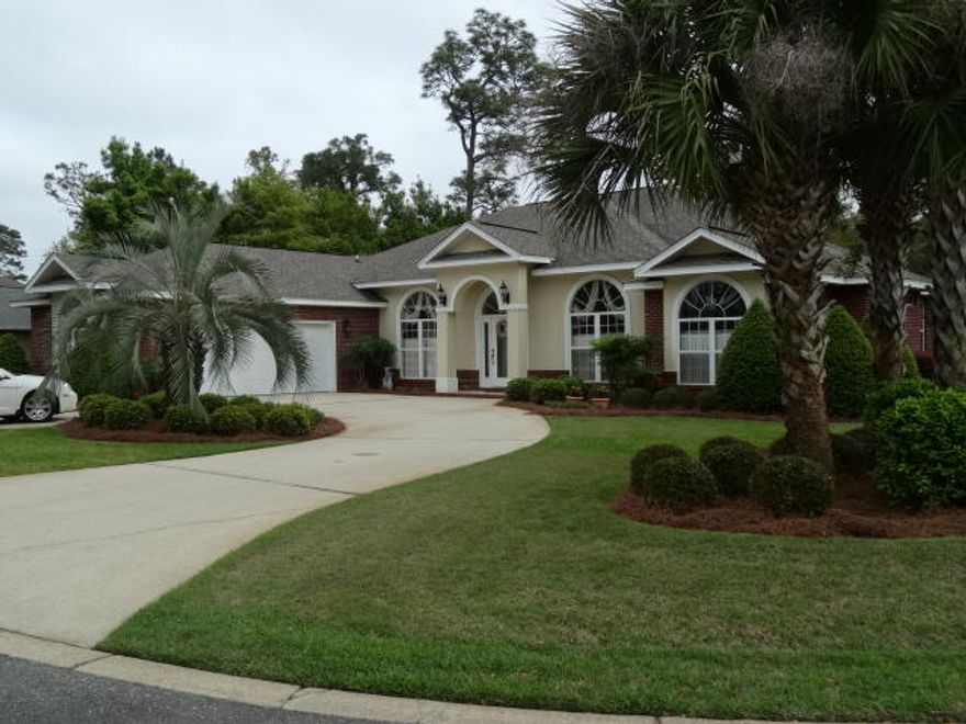 Tasteful and stylish is this custom 4 bedroom, 3 bath home that was built to live large. Many gracious upgrades during construction throughout are immediately noticed when entering. Suited to entertaining large crowds with an exceptionally large eat-in kitchen and dining room which open to the family room and covered porch and pool area. The family room is centrally located and opens directly to the porch and pool by way of a 9' sliding pocket door greatly expanding the living space. The split floor plan affords privacy with the master suite located off the kitchen in rear. The master bedroom has 9-10' trayed ceiling with double french doors leading to an enormous 16x21' luxurious bathroom. Exquisitely designed with Roman shower, soaking tub, his/her vanities and private toilet closet.