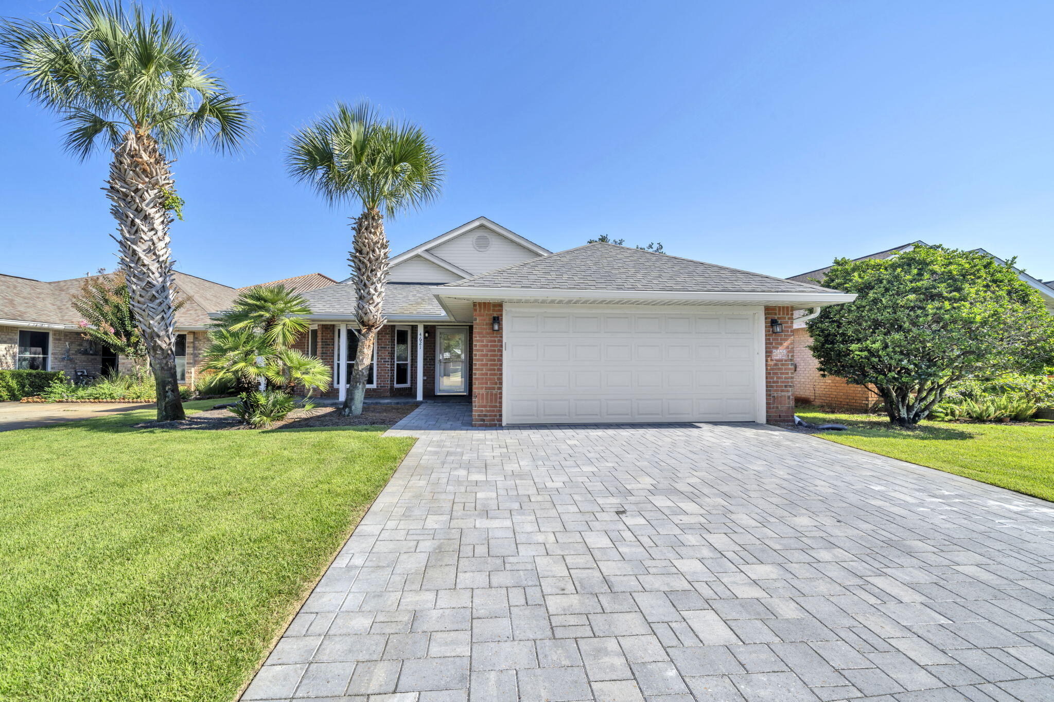 Welcome to this beautifully updated 3 bedroom/2 bath home in the desirable community of Sunsail, located just blocks from Destin's beaches! Meticulously maintained by the same owner for 20 years this home features porcelain tile floors, updated bathrooms and kitchen, fresh interior paint, and a whole-house water filtration system. Large 2-car garage with pavered driveway/ Golf Cart being sold separately. Step outside to your own private oasis with a new custom swimming pool and privacy fence, gorgeous paver decking and a covered lounge area, perfect for entertaining or relaxing year-round. Large yards that can accommodate a pool are a rarity in Sunsail, making this home a must-see for full-time living, vacation, or investment.