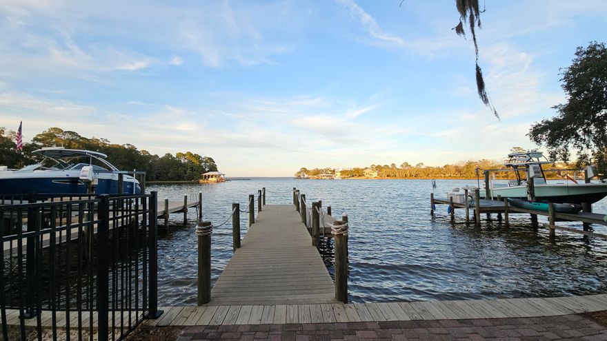 PET FRIENDLY~Charming two-story residence nestled in the serene waterfront community of Sacred Oaks in Santa Rosa Beach, Florida. Community dock. This inviting home offers 2 stories, 3 spacious bedrooms and 2.5 well-appointed bathrooms within its 1,600 square feet of living space. Open floor plan as you walk in. Modern kitchen equipped with granite countertops and tile flooring, stainless steel appliances, plenty of cabinet space. Through the french glass doors you enter into the outdoor living area. There is a grilling area, shed table chairs, your own personal oasis. All Property Management on the Panhandle residents are enrolled in the Resident Benefits Package (RBP) for $50.00/month which includes liability insurance.