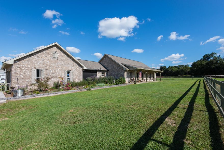 An Equestrian Paradise. 38 acres of prime land Located in Holt. A 2200sqft main house and a 3200 sqft metal barn also a tack room and stables and more. This beautiful farm setting has many income potentials, from raising cattle to a possible air strip(tbd) and currently growing hay. Home's in excellent condition with many interesting features from a screen in breeze way with fireplace to cathedral ceiling with rustic open beams. super large bonus room upstairs. 3200 sqft. metal building includes an apartment