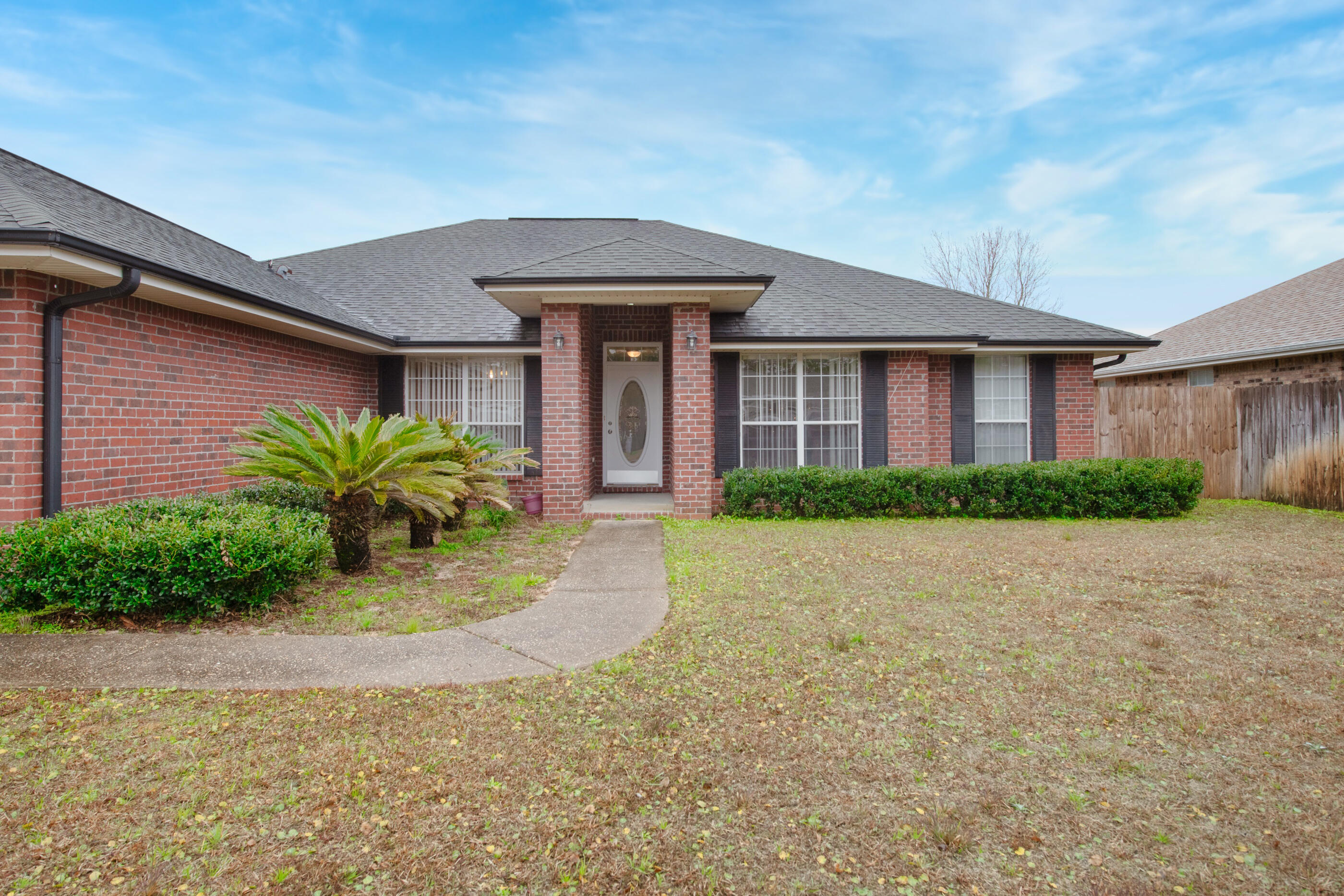 Back Up Offers Being Accepted! Welcome home to this fresh take on 2022! Such a perfect location just far enough from 98 to lose the traffic noise, but easy access via a light. No HOA! East end of Navarre makes your commute easy! This fabulous neighborhood home has fresh paint and flooring. The ever-popular split floorplan lines up the large en-suite master behind the great room, and the three spacious bedrooms reside behind the kitchen area. Very roomy closet space! Fireplace, dining room AND a Den, covered screen porch, and fenced back yard. Living space galore in this one. Roof 2004, HVAC 2016, Water Heater 2012. Seller will add new roof with a great offer!!