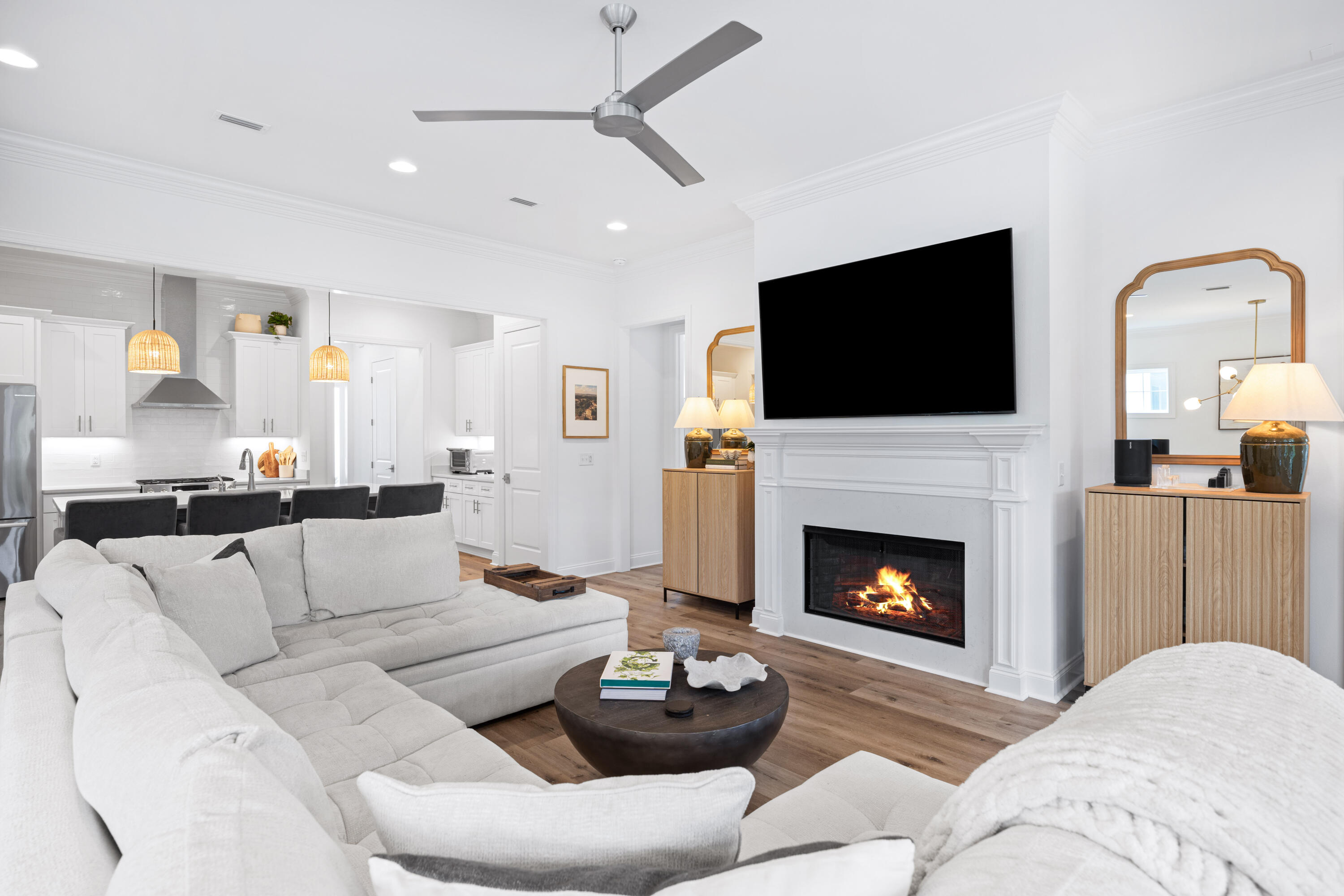 This exceptional like new single-story home showcases coastal-inspired design, modern upgrades, and a seamless open floor plan perfect for everyday living or entertaining. Offering 4 bedrooms, 3 bathrooms, and soaring 10' ceilings, every space is thoughtfully crafted with comfort and style in mind.At the heart of the home, the chef's kitchen boasts an expanded quartz island, custom wood cabinetry with soft-close features, and Bosch stainless steel appliances including a gas range with vented hood, built-in microwave drawer, and refrigerator. The spacious living area is anchored by a gas fireplace with custom mantel, while recessed lighting and modern ceiling fans add warmth and ambiance throughout. Upgraded touches continue with custom shelving in all closets and pantry, crown molding and luxury vinyl plank flooring for a polished yet durable finish. Step outside to enjoy an expanded screened back porch with heirloom brick flooring and a private fenced backyard, creating the ideal retreat for both relaxing and entertaining. Additional highlights include a two-car garage, tankless hot water heater, and irrigation system for effortless everyday living.
Located within Watersound Origins' Longleaf Park neighborhood, residents enjoy exceptional community amenities such as a resort-style pool, fitness center, golf course, and miles of trails surrounded by natural beauty. This home is the perfect blend of modern luxury and laid-back coastal living in one of 30A's most desirable master-planned communities.