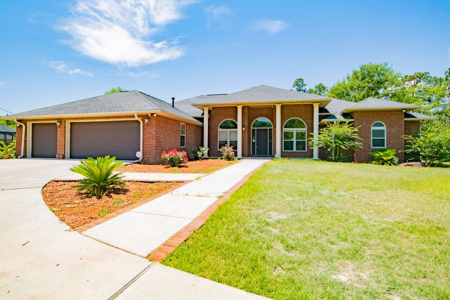 This wonderful custom-built home with a 3 car garage, is situated on over 2 acres and has so much to offer! Perfect for entertaining, this spacious home has 5 bedrooms and 4.5 bathrooms. The kitchen has brand new granite counter tops, under mount sink, and if fully equipped with a 5 burner gas stove, stainless steel appliances, walkin pantry and a breakfast bar. With an open split floor plan you'll enjoy the private master suite on the opposite side of the home. The suite has it's very own foyer with separate vanaties, over-sized custom walk in shower, jetted tub, his and hers closets, linen closet and a dressing area. There is also a bonus room perfectly suitable for a pool table or would make a great play room. Of the other 4 bedrooms, 2 have ensuite bathrooms and 2 are adjoined by a Jac This wonderful custom-built home with a 3 car garage, is situated on over 2 acres and has so much to offer! Perfect for entertaining, this spacious home has 5 bedrooms and 4.5 bathrooms. The kitchen has brand new granite counter tops, under mount sink, and if fully equipped with a 5 burner gas stove, stainless steel appliances, walkin pantry and a breakfast bar. With an open split floor plan you'll enjoy the private master suite on the opposite side of the home. The suite has it's very own foyer with separate vanaties, over-sized custom walk in shower, jetted tub, his and hers closets, linen closet and a dressing area. There is also a bonus room perfectly suitable for a pool table or would make a great play room. Of the other 4 bedrooms, 2 have ensuite bathrooms and 2 are adjoined by a Jack and Jill bathroom. Other notables are a whole house 360 security camera system, circular driveway for additional parking, large laundry room with utility sink and extra storage, all house blinds, gas fireplace, handicap accessible half bathroom, gutters, generator hook-up, paved walkway to the rear of the home and surround sound in the living room and master suite. New HVAC in 2017 and is plummed for gas for an outdoor kitchen. Fresh paint throughout. Relax on your lanai and enjoy being surrounded by wildnerness and watch for the friendly deer that often stop by for a visit!