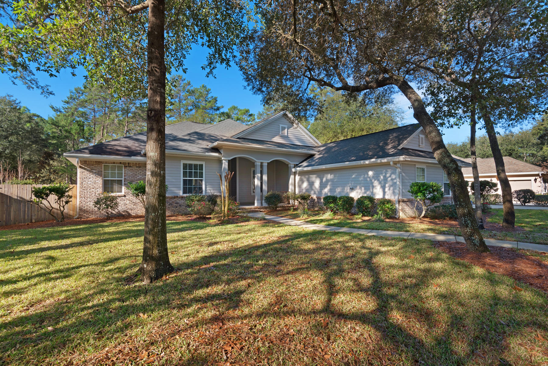 Beautiful four bedroom, three full bath home in Niceville's prestigious Swift Creek neighborhood! This Arthur Rutenberg design home is on .35 of an acre lot and has many wonderful upgrades - Timborana hardwood flooring in the main living areas, granite countertops throughout, travertine in foyer, crown molding, solid wood cabinets and stainless appliances in the kitchen, and recently added whole house water softener and kitchen filtration system...just to name a few. 112 Blossom Creek Run offers two living areas, an office, formal dining room and an over-sized screen lanai. Perfectly manicured landscaping, a beautiful, spacious backyard and 3 car garage complete this conveniently located home. Call today for your showing as this one won't be on the market long...
