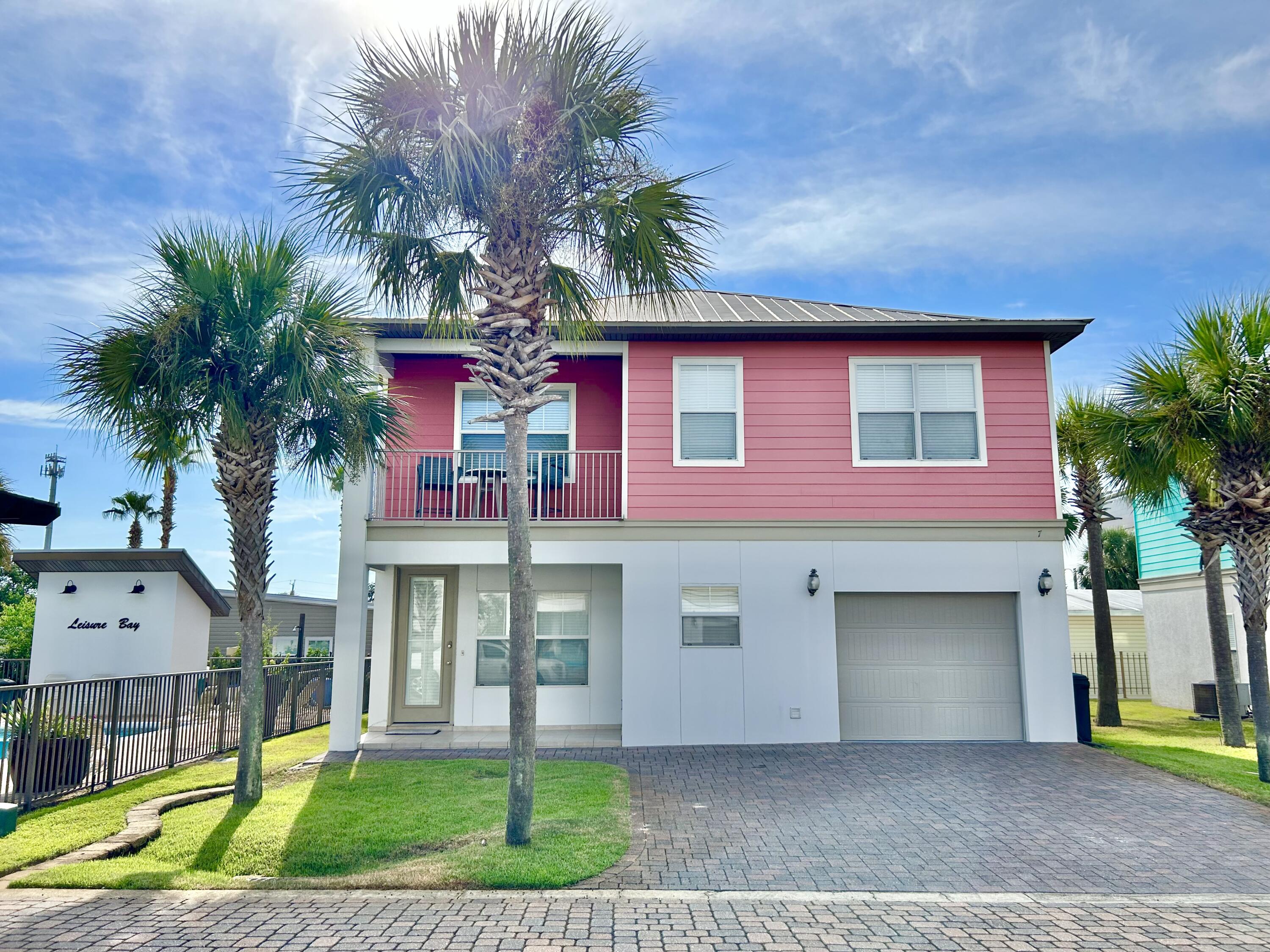 LOOKING FOR BACKUP CONTRACTS Leisure Bay has 10 homes in this and serene beach community - only 3 blocks to the beautiful beaches. This Immaculate home that will not disappoint with all its upgrades: All tiled, 9 ft ceilings, crown molding throughout, tiled showers and tubs, granite countertops, modern lighting and fans. Two large living areas w/lots of light. The Kitchen has stainless steel appliances, a bar that seats 4 & an elegant metallic tile backsplash. There are 4 full bathrooms w/beautiful tile, granite & pendant lights. The oversized one car garage has lots of built-in storage. HOA takes care of all lawn maintenance, pool & picnic area. The streets/driveways are concrete pavers. 61-86k Poss income Sold Furnished! Walk to beach bars & eater