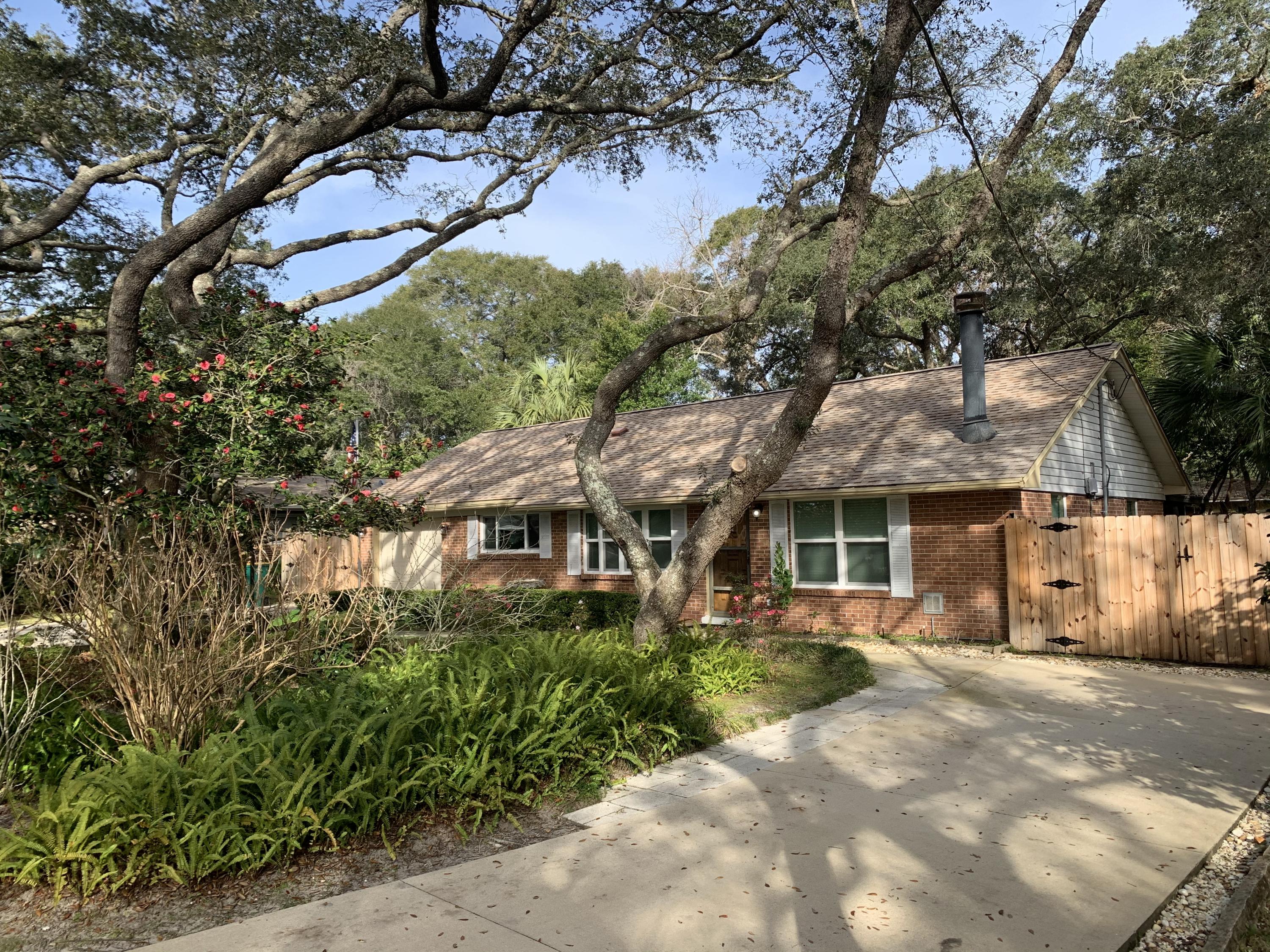 Completely renovated home in highly sought after neighborhood. Bonus room that can be used as a 3rd bedroom. Gas fire place in large living room. Large fenced in back yard, extra deep 1 car garage, screened in back porch plus large deck and another covered porch in back yard. Majestic trees and beautiful landscaping. 2 driveways with outside electrical RV outlets on each side. Quiet neighborhood. Home is across the street from the water. There is a neighborhood boat ramp. New insulation in attic keeps power bills low and house very comfortable. Small porch off master with air conditioning. Lots of living space inside and out. Bedrooms are large. Bathrooms are very retro and super cute.