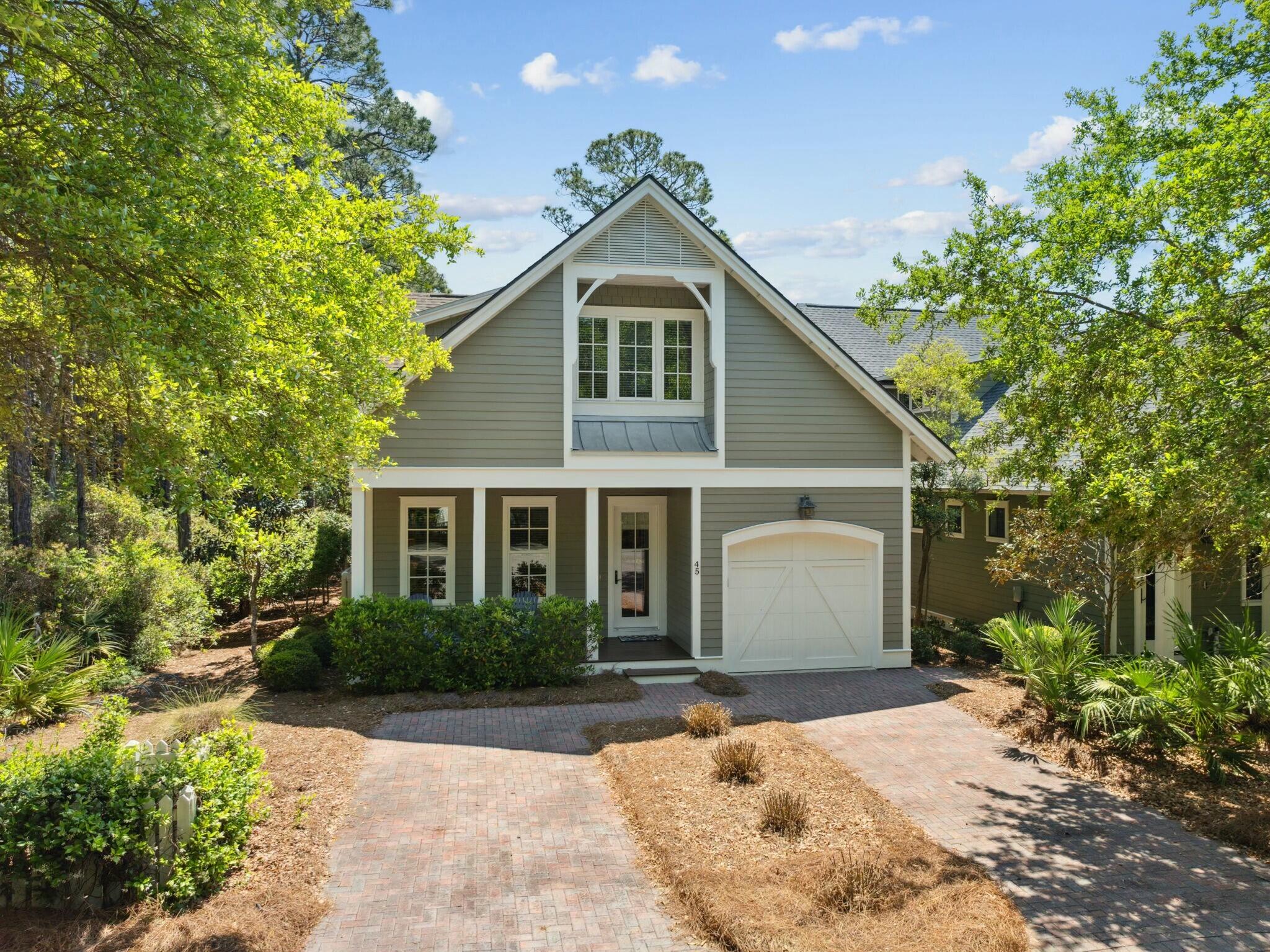Nestled in the coveted gated community of Watersound West Beach, this stunning home sits on a desirable corner lot adjacent to a peaceful wooded area, offering added privacy and serene natural surroundings. Impeccably maintained and never rented, this home is the perfect retreat for both a beachside getaway or a primary residence. From the moment you step inside, you'll be captivated by the warmth of rich Walnut hardwood flooring and the inviting open-concept design. The living room, dining area, and kitchen are bathed in great natural light, creating a bright and welcoming atmosphere. The thoughtfully designed first-floor primary suite offers convenience and comfort, while the beautifully appointed kitchen features custom cabinetry, Wolf and SubZero appliances, and elegant... Cont... finishes that elevate the space. A dry bar adds to the home's functionality, complete with a SubZero under-counter refrigerator and a new Scotsman ice maker.
Upstairs, the home continues to impress with abundant natural light streaming into the versatile loft area, making it an ideal space for a home office or secondary living area. Two well-appointed guest bedrooms and bathrooms complete the second floor, offering comfort and privacy for family and guests. Every detail of this home has been carefully curated to create a truly one-of-a-kind living experience.
Step outside to the expansive rear screened porch, which stretches the width of the home and offers a serene view of the quiet boardwalk, perfect for relaxing and embracing the coastal breeze.
Watersound West Beach is a sought-after boutique community spanning 66 acres with only 199 homesites. With deeded beach access, a welcoming mix of full-time and part-time residents, and no short-term rental restrictions, this neighborhood provides an unparalleled coastal lifestyle.
Don't miss the opportunity to own this exceptional home in one of 30A's most desirable communities!
