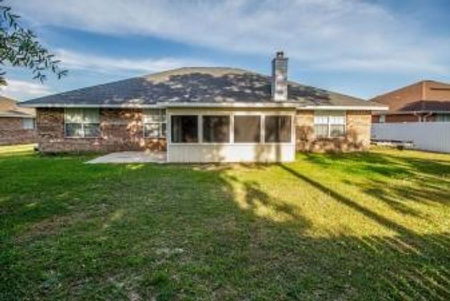 Recently renovated, solid brick one story home has impressive brick pillars flanking covered front porch & entryway w/above door transom style window. Sunroom view of large yard. Tile foyer opens to formal Dining Rm & Living Room w/vaulted ceiling & wood burning fireplace straight ahead. Fresh paint and carpeting throughout. Kitchen: Lots of Cabinets & Counters + Pantry closet. Spacious Master w/large ensuite Bath. In home Laundry Rm w/W & D. Quiet neighborhood. Transferable Terminix contract.
