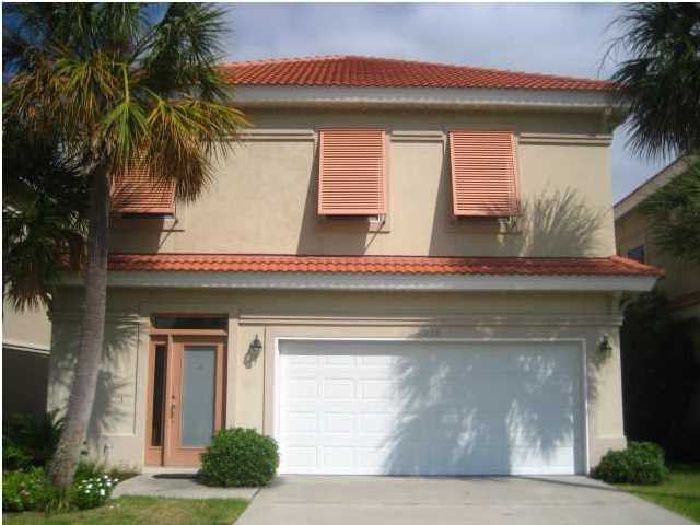 Lovely home ~ great location in the heart of Destin ~ in a gated community! 3 bedrooms and 2 1/2 baths upstairs and an open floor plan downstairs! All new stainless steel kitchen appliances, tile flooring, glass sliding doors open onto a covered patio with privacy fenced backyard. New AC units, sprinkler system, and a 2 car garage. Large master bedroom and bath with his & her walk-in closets and a screened balcony off master bedroom. Community Pool.