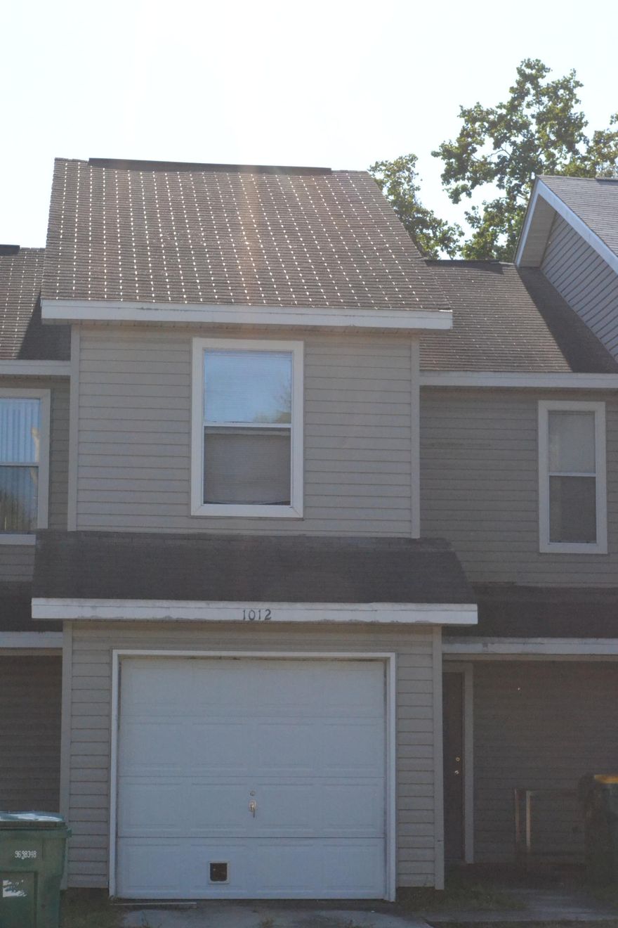 Spacious townhome close to the local high school, middle school, and Boys and Girls Club which provides after school care and fun activities over the summer for children.Upstairs you will find both bedrooms have their own private full bathrooms. Laundry room is located upstairs as well. Owner would prefer to sell ''as is.''Downstairs has an open floor plan with a bar to the dining area which leads to the living area. Wood burning fireplace is always a plus during cold winter months. Small backyard is easily maintained.Townhome stays rented. Easy money maker for an investor.BRAND NEW ROOF INSTALLED 1/2018.