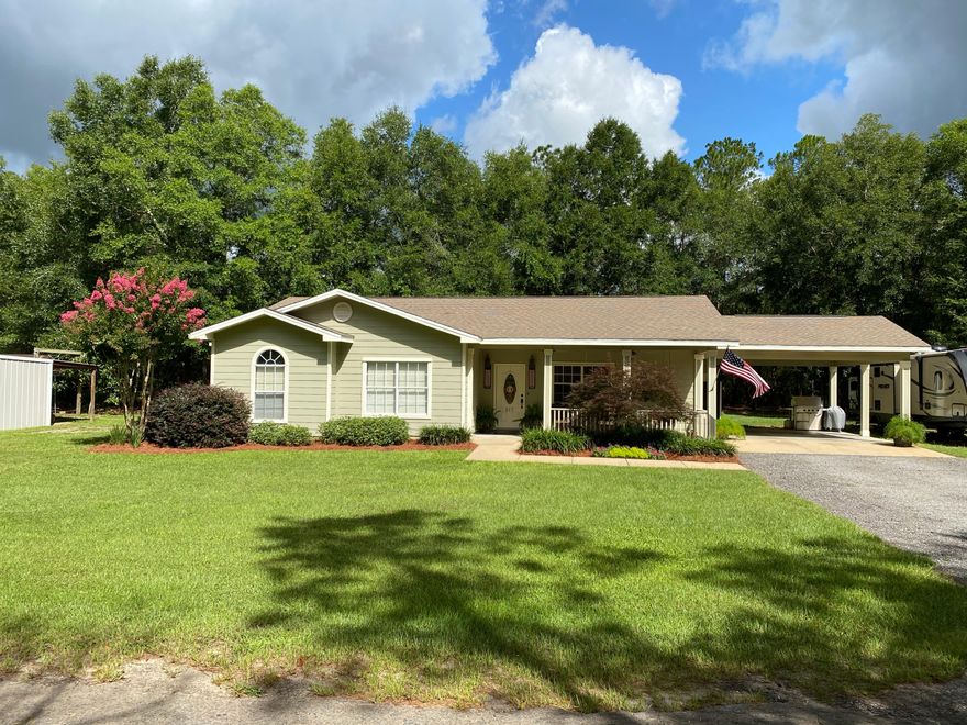 Delightful custom home, designed for those who prize craftsmanship, lush landscaping and a low-key lifestyle. Located on nearly 2 acres on a quiet dead-end road, less than 10 min outside of historic DeFuniak Springs and 40 minutes to the beaches. The quality is evident in every fine detail, from the Acacia wood floors to the custom maple cabinets & granite countertops. Take in all the kitchen has to offer: travertine backsplash, under cabinet lighting, handy spice drawers, custom pantry w/ pullout drawers - the list goes on! The master suite is perfectly appointed w/ dressing area & walk-in closet, double vanity, jetted soaking tub & separate shower. Laundry is oversized with 1/2 bath & room for freezer. Lavishly landscaped w/ a stunning Red Japanese Maple. Don't miss the Virtual Tour!
