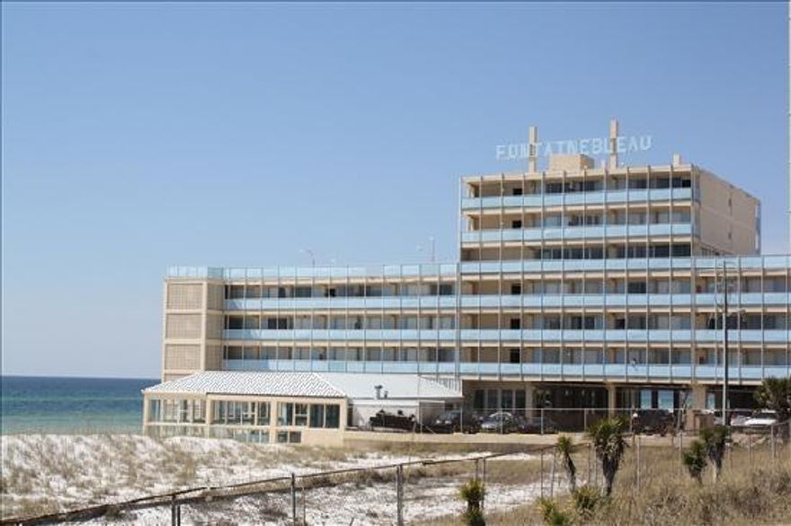 Own a piece of history on the beautiful Gulf Coast with this renovated studio that overlooks Bid-A-Wee Beach & the emerald blue waters of PCB! The Fontainebleau Terrace has been a landmark in PCB since the 1960's. With this distinct architectural building, you are only footsteps from the gorgeous white sand of the Gulf. This renovated 2nd floor studio is a prime piece of beach property that has been recently painted, with new decor, a new pillow top mattress on the queen size bed, a queen size sleeper sofa & a beautiful new tile floor. Enjoy the Olympic size heated pool, cook out on the huge 2nd floor balcony or play shuffle board on the newly designed ground floor deck. All utilities, including WiFi, are included in the monthly HOA.