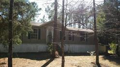 Nice mobile home in the Laurel Hill area. Home features a nice sized living area with a laundry area and a dining area with sliding doors that lead out to an open deck. Lots of potential! Act fast! This home won't last long!