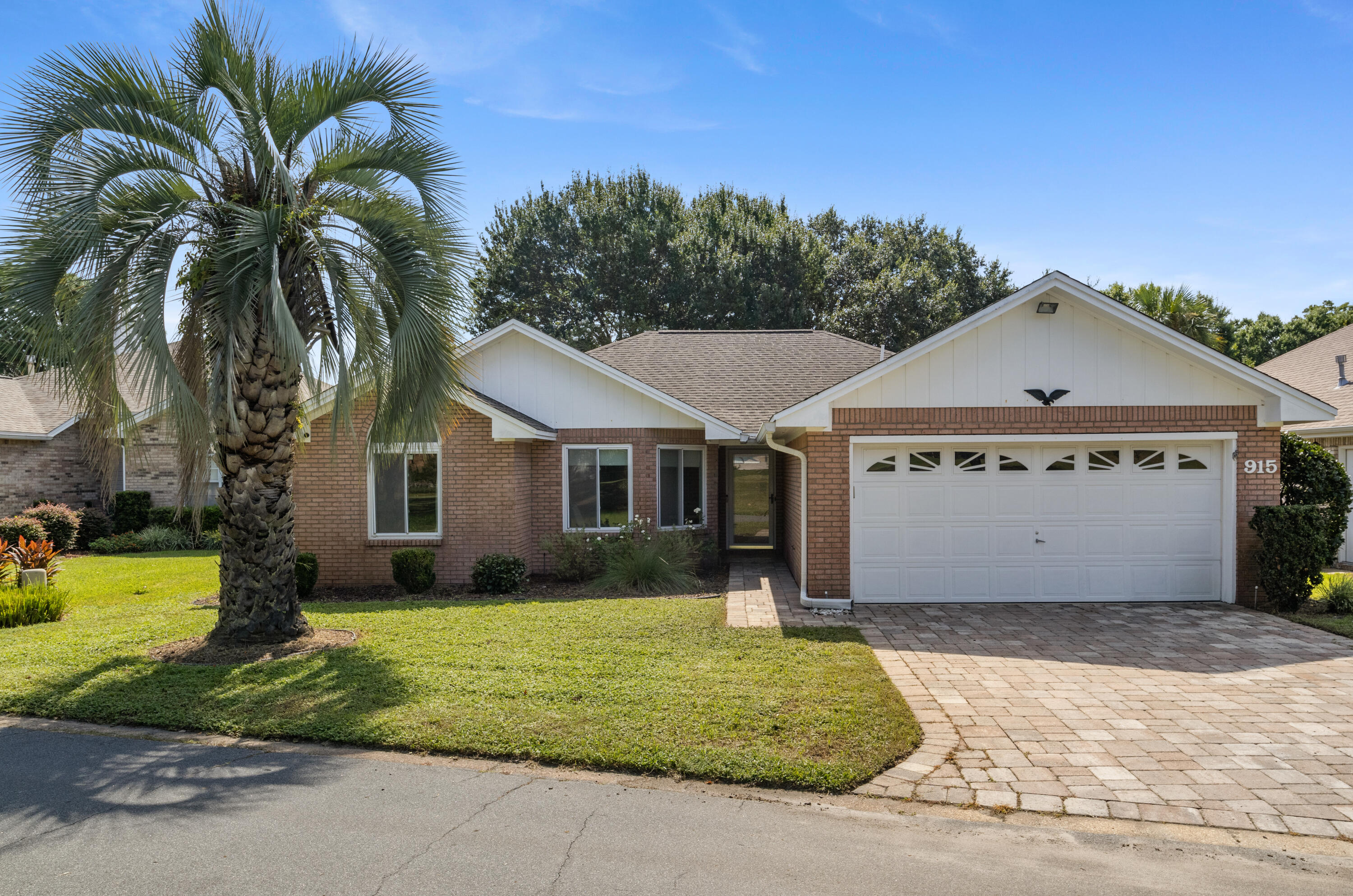 Located in the charming gated Shalimar Pointe golf course community, this single-level brick home offers practical updates and a functional layout. Recent improvements include new interior paint, carpet, updated kitchen lighting and hardware, and renovated bathrooms. The primary suite features two closets and access to the heated/cooled Florida room. Additional highlights include cathedral ceilings, bay window dining area, epoxy garage floor, generous natural light, sprinkler system, gutters, and paver driveway. Situated between the 3rd + 9th holes and in Flood Zone X (no flood ins required), this home also offers an assumable 3.75% VA loan to a qualified VA buyer. Convenient to military bases, golf, and the beaches of the Emerald Coast. Video tour available upon request. Welcome home!