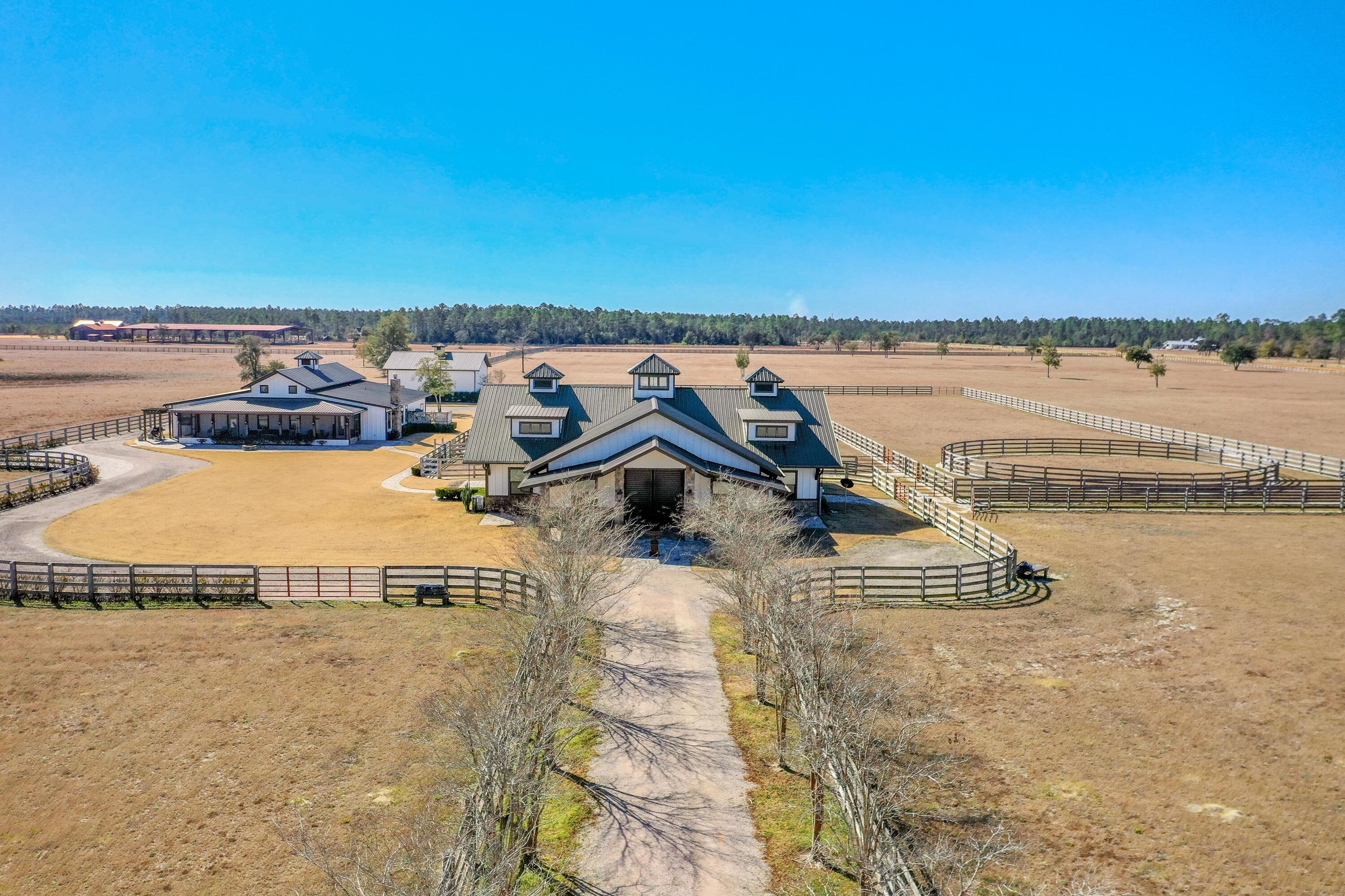 The elite equestrian community known as the Stables at Sandy Pine accommodates a horse-lover's dream lifestyle.This subject assemblage of four prime parcels of Walton County, Florida is located within an approximate 50-minute drive to the beaches of South Walton County and Scenic 30A of Santa Rosa Beach, Florida. This is a fully turn-key opportunity, including all furnishings, electronics, and entire utility building of farm equipment, including a tractor, bush-hog, zero-turn professional riding mower, atv's, etc. The finishes throughout are nothing short of extraordinary, rivaling world-class barns fit for the finest of thoroughbreds. Each of the six stalls offer the horses deluxe accommodations, including double-rotating fans, automatic watering bowls, anti-fly misting system, and...