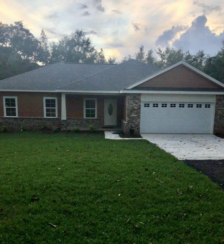 Beautiful two-acre parcel in North Baker. Heavily wooded, offering peace and quiet. Large, open concept living space. All kitchen appliances included. Master bedroom has an ensuite bath with double vanity, a garden tub and separate shower. A large, wood deck is off the dining room, perfect for grilling. A big backyard is great for family and friends to gather.