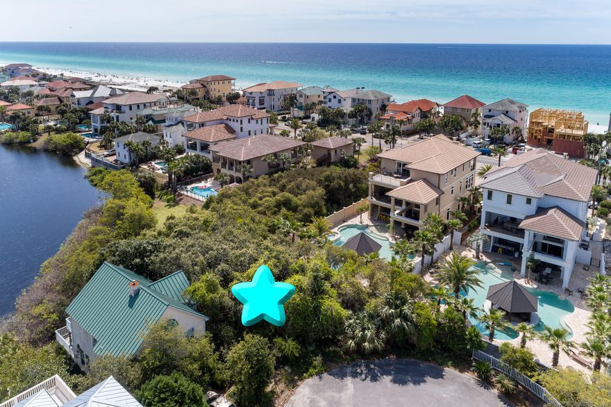 NEW PRICE!! This is it! Rarely do these lake front lots become available. And this is one of the nicest residential lots in the neighborhood. Located at the end of a quiet cul-de-sac, just two blocks from the Gulf of Mexico! With the right home design, gorgeous Gulf views are a possibility! Kokomo Kove is a quaint beachy retreat with lots of shady trees, picket fences, AND gated Gulf beach access. This is a great opportunity for that beach lifestyle you've been dreaming about. AND minimal association fees, unlike most nearby neighborhoods. Come check it out!