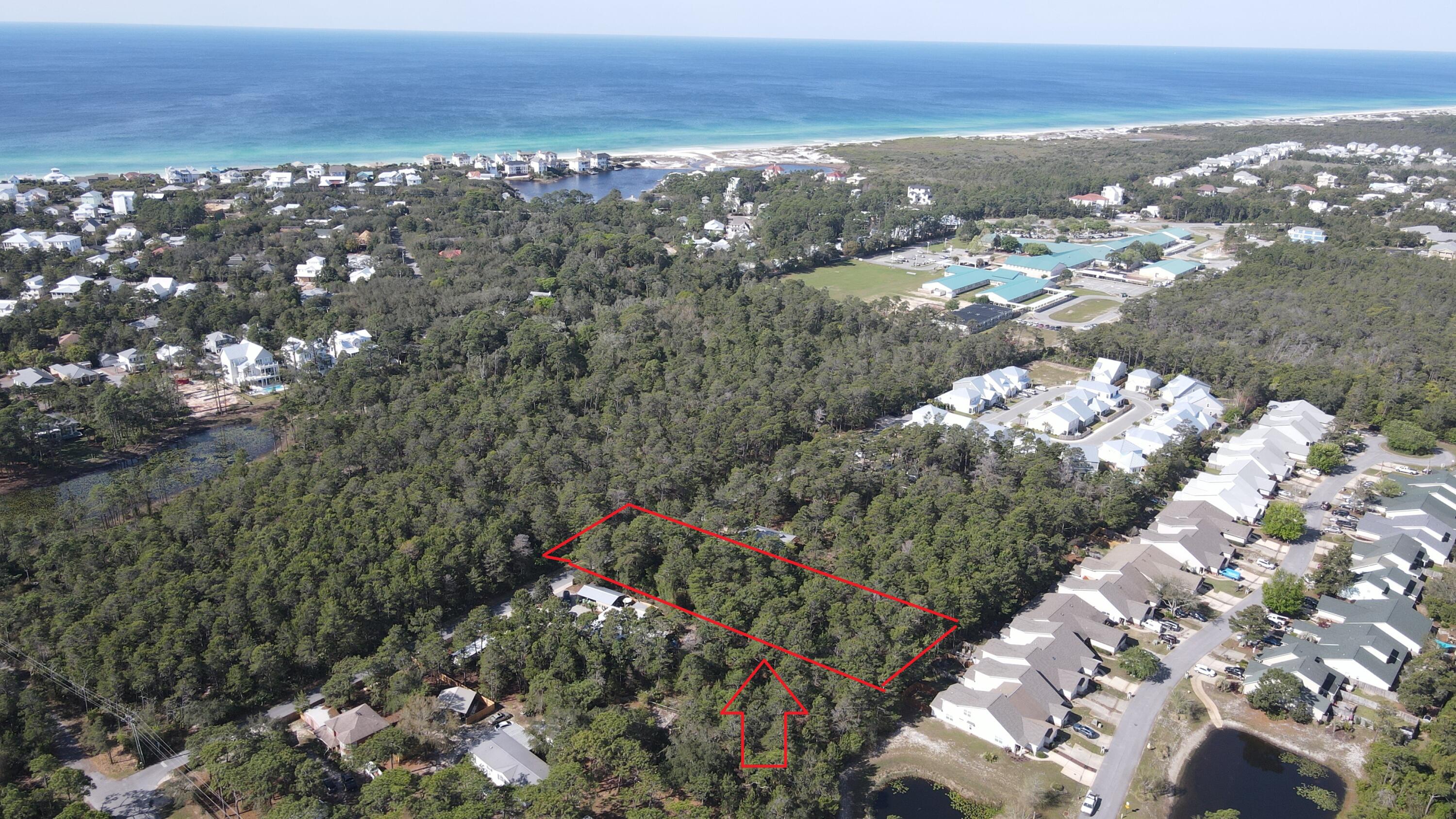 Rare opportunity to buy .69 undisturbed acres South of Highway 98 and less than a mile from the beaches. The property has 60 feet width along Rachel Road and 330 feet length back, it opens up in the back to a 136 foot width, perfect for a home. Property has a pond view. Utilities available are city water, city sewage, phone, natural gas, and internet are available on Rachel Rd. Must see to appreciate. Trails lead to bike paths on 30A, which also lead to beach accesses, shops, parks, Butler Elementary, restaurants and more. The property is .69 acres of an existing larger parcel. The west most .69 acre of the property. All dimensions are approx. and will need to be verified/surveyed. Exact dimensions will be determined by survey.