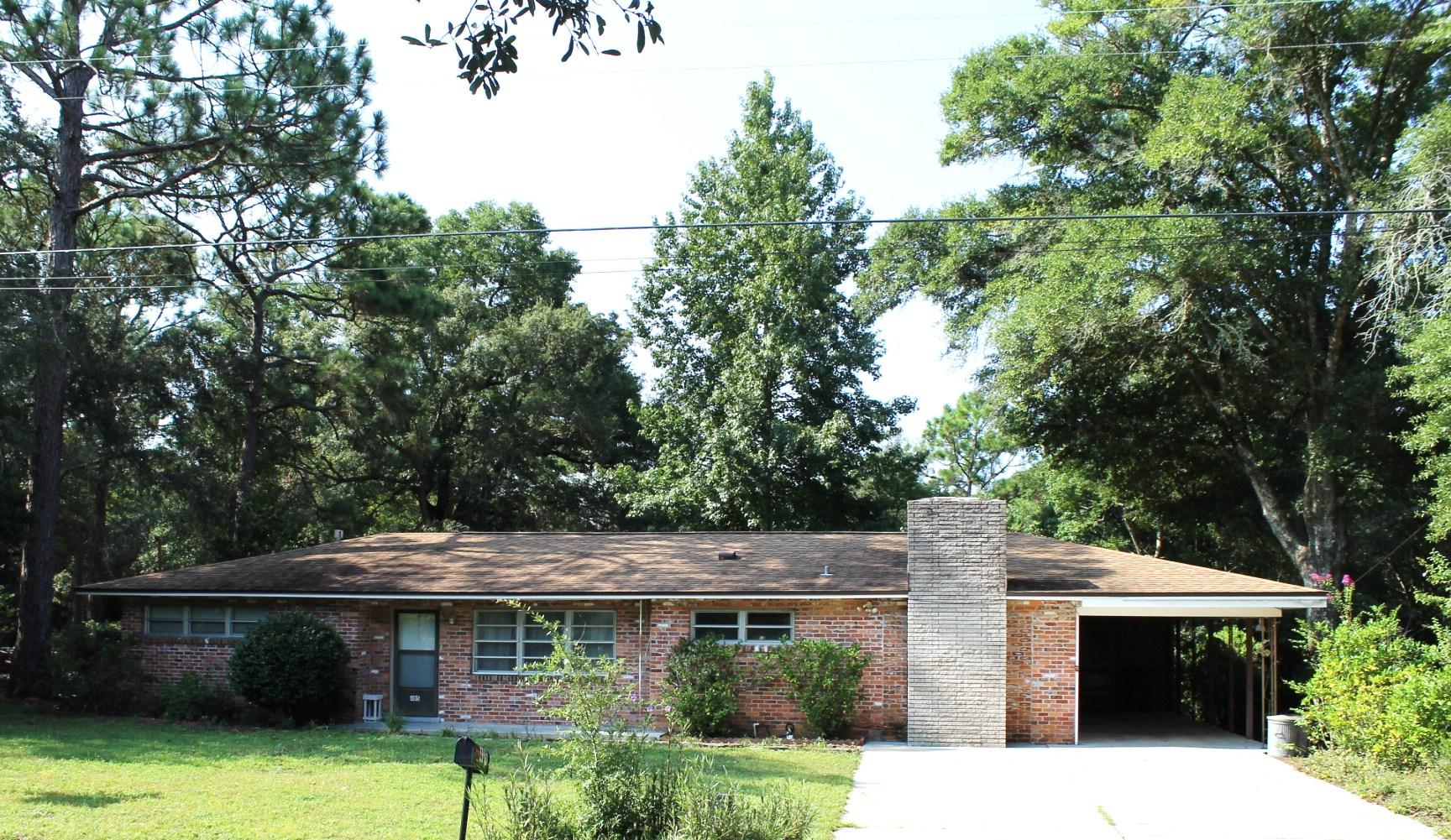 Location, Locaton, Location!!! All brick home located on .49 acres close to Eglin AFB and Duke Field. Perfect as a starter home or investment property. Home features are: Formal Living and Dining room, Family room, Florida room, Eat-in kitchen, Fenced Yard and a Wood burning fireplace. The A/C unit is new, and the roof was replaced in 2011. There are parquet floors underneath almost all of the carpet. Another great feature is the extra-long carport with storage area. The backyard is fenced and has a LARGE workshop with electricity. This home backs up the Eglin Reservation for added privacy. This home also has a termite bond. This home is a MUST SEE!! Buyer to verify all dimensions.
