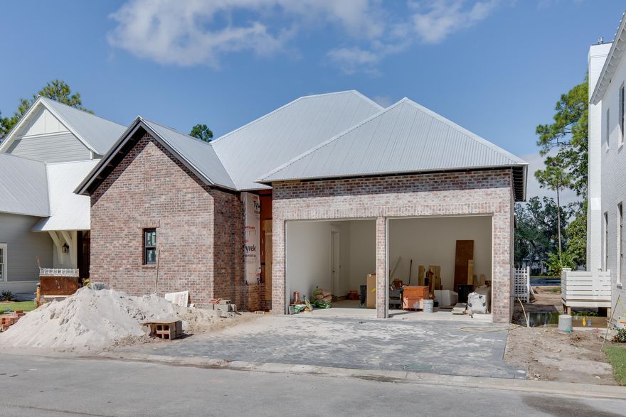 Under construction in the Churchill Oaks neighborhood, the Pearl plan is a charming one-story design with three bedrooms and three- and one-half bathrooms, a two-car garage, along with a private courtyard. Enjoy the warm Florida breeze from the covered outdoor living space in the courtyard with summer kitchen and swimming pool. Inside, the open-concept kitchen, dining, and living area are accented by 16' wood vaulted ceilings with beautiful wood beams, wood burning fireplace, Thermador appliances, and stunning lake views. This home will also be finished with white oak hardwood floors, a mahogany front door, custom full overlay shaker cabinetry, quartz and marble countertops, copper gas lanterns, and more Tucked away amongst native vegetation and the calm waters of Hogtown Bayou, Churchill Oaks offers a lifestyle of elegance and appreciation of nature. Once inside the stately gated entrance, magnificent coastal homes accentuate southern architecture under a canopy of old oak trees. The 40-acre community is comprised of 87 homesites and some of the best amenities in South Walton. The latest amenity to the community is a deep-water, private marina. The marina project includes 36 private boat slips, paddle board storage decks, a fish cleaning station, shoreline stabilization + more! The Churchill Oaks Clubhouse is an outstanding 8,000 square foot amenity situated on a point on the Bay with stunning views. Three pools, exercise room, outdoor bar, fully equipped media room, commercial grade kitchen, bath and locker rooms, and large gathering spaces are all found at the Clubhouse for owners and their guests to enjoy. * Please verify with on-site agent the total New Buyer fees due at closing.