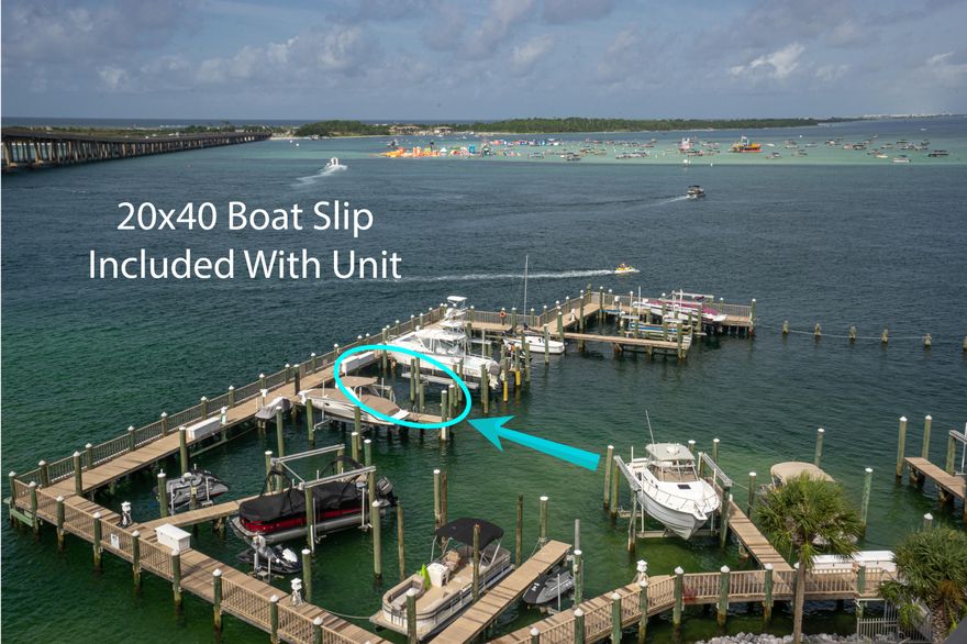 Breathtaking views are often talked about but not often realized. This property is truly an exception. Coming out on the balcony of this space is like seeing the view from a mountain summit over the ocean. The boat activity, bridge, fireworks and sea life including dolphins, manatees, rays, schools of pompano and other provide an array of eye candy and constant entertainment. The family who lived here enjoyed years of catching red fish and others right off the docks, walking to all of the Harborwalk festivities, McGuires, and Dewey Destin's on the bay. The unit itself is spacious with tall ceilings, large rooms, large bathrooms and a split floorplan to allow the place to feel more like a home than a condo. The boatslip is 20x40 along with paddleboard/kayak storage & gated/covered parking