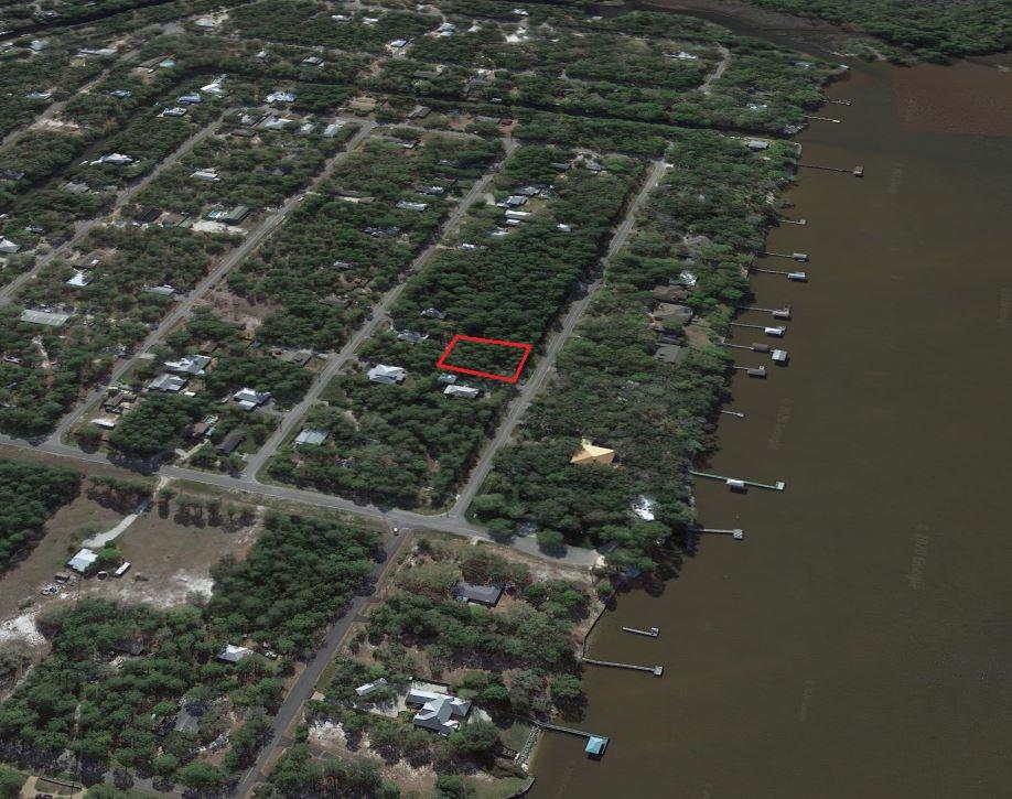 LOWEST PRICE LOT ON W MITCHELL AVE. Beautiful wooded lot in one of the most coveted streets in all of Point Washington. Directly across from the Choctawhactchee Bay, this vacant lot would allow future home to have possible bay views. No HOA or buildout time. Located in flood zone X (no flood insurance required). New construction on this street make this lot a great buy-and-hold investment or perfect to build now. The neighborhood of Daughettes S/D is seeing a lot of activity right now. 5 minute drive to Grayton Beach.