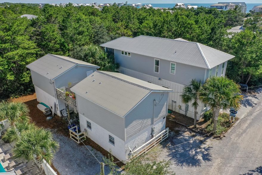 This beach retreat is a short walk to the sugar sand beaches, with two beach accesses on Eastern Lake in Seagrove.  This opportunity south of 30A has unlimited potential as dual long-term rentals or as the site of your dream beach home. Each unit features two bedrooms, two full bath,  kitchen and living areas with a shared front porch. This property is located on a quiet, dead-end street within walking distance of two beach entry points and access to a rare coastal dune lake.