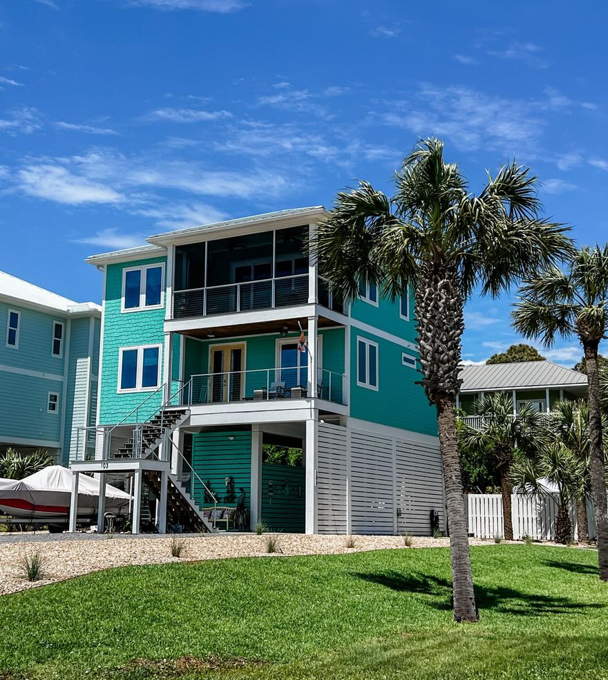 There are 1st tier luxury homes with unobstructed views of the Gulf of Mexico and then there is this turn key and fully furnished beachside gem! So many extras, we needed an amenities list. Completed in 2022 and never rented, this 4 Bedroom, 3 bath home was designed for entertaining and beachcombing. Delightfully appointed inside throughout with a nautical flair that flows to an outside pool, spa, and bar entertaining oasis. Built by one of the premiere builder in the area, Pepperfish Construction, the custom details inside and out are apparent in the details. GROUND LEVEL consists of; beautiful xeriscaped/ palm accented corner lot, 8+ parking spaces, double concrete and covered bays, one high enough for boat/RV storage, RV water and sewer hookup, 400 amp service, Generac for entire house
