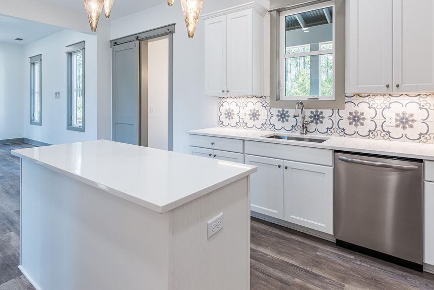 UNDER CONTRACT with a 48 hour kick-out clause. Accepting Back-up Offers.Upscale new construction retreat in the gated reserve of RiverCamps on Crooked Creek. Enjoy the modern rustic design in this 3 BR/3.5 BA home with 2-car garage. The first floor has 10' ceilings and includes a guest suite, powder room, and large kitchen overlooking an open concept living/dining area, plus a spacious screened in porch that is perfect for entertaining! The 2nd floor has 9' ceilings includes a master suite, laundry room, loft space, and an additional bedroom. Notable features include quartz kitchen counters, oak shaker style cabinetry, designer light fixtures, luxury vinyl plank flooring with carpet in bedrooms, Venetian Marble countertops and subway tile in bathrooms. Exterior features include Aged