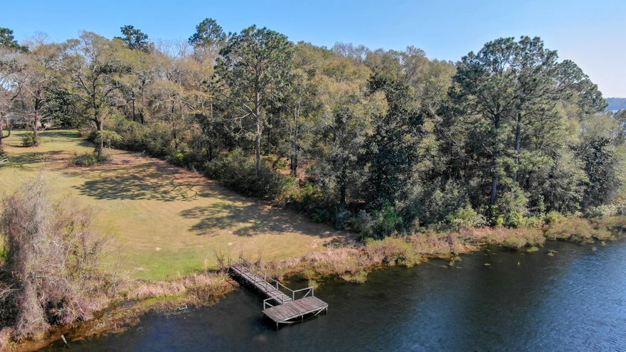 Ripe for Development or as your own private waterfront estate! Live like a King on the last large acreage parcel available on King Lake. This 17+/- acres has 1716+/- of Waterfront feet. Current zoning is Rural Village, allowing two homes per acre which would make this the perfect place for development. Plans have been drawn to show possible layout of lots should you decide to develop this waterfront beauty! There is a main home and guest home on this property. Both have had recent upgrades. Also included is a large detached garage. Enjoy beautiful sunsets from this parcel. Property has mature magnolia and oak trees. It is simply beautiful. Property shown by appointment only. Call for your tour today!