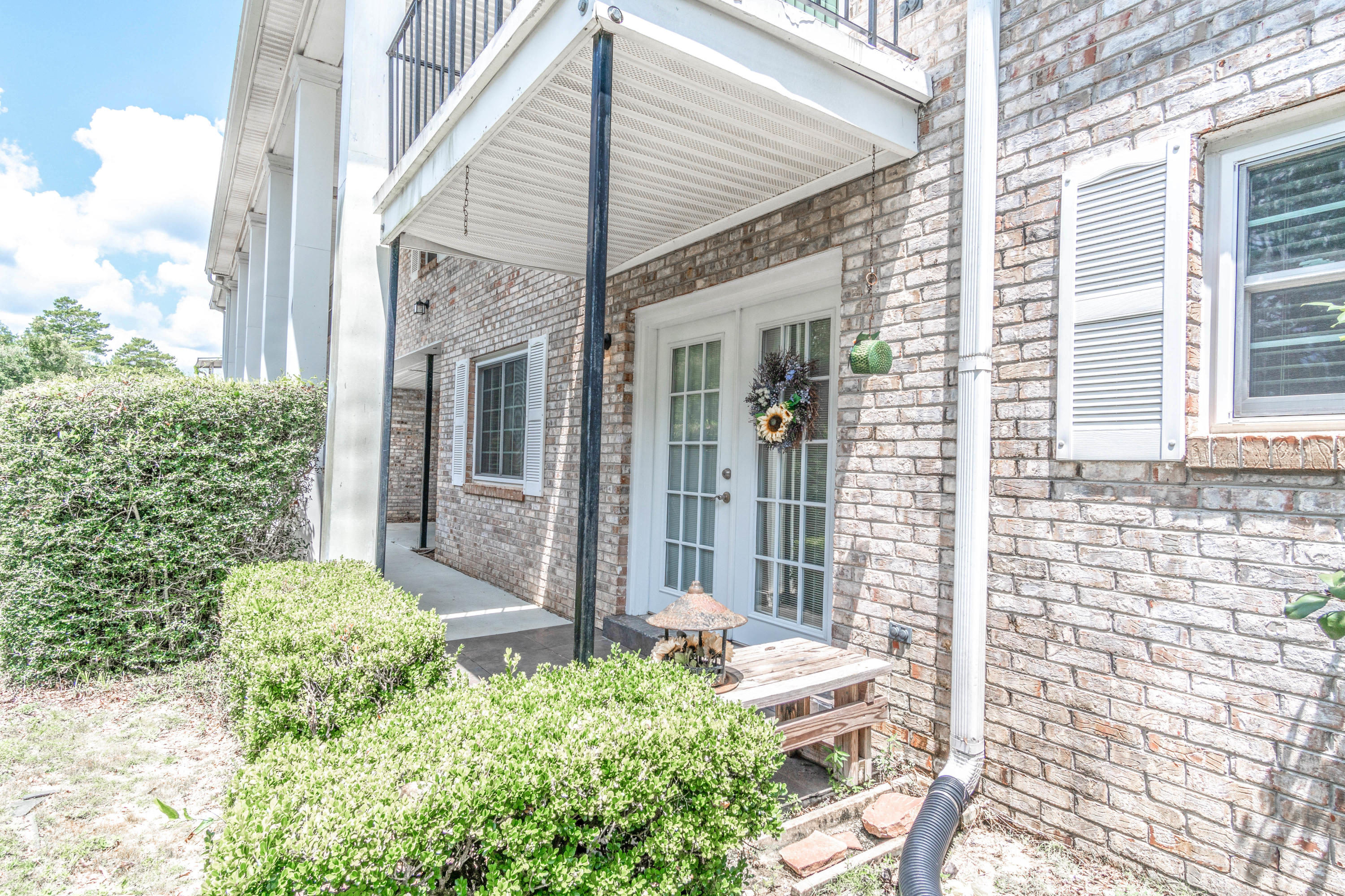 This very appealing condo offers up to date comfort with an inviting flow. The owners have kept this place in outstanding condition.Open living/dining design provides a center for everyday activities and is a beautiful space with French doors. Exit through the French door and step out onto the covered patio where there is always a breeze. Modernized kitchen with stainless steel appliances, counter tops and tile flooring is a cozy place for quick bites and midnight snacks. Split bedroom plan offers quiet separation making sleep easy and two baths which means no waiting. Large size master bedroom includes private bath featuring a spacious closet and private dressing/vanity area. This condo includes a community pool, extra storage space on the second floor along with washer and dryer access.