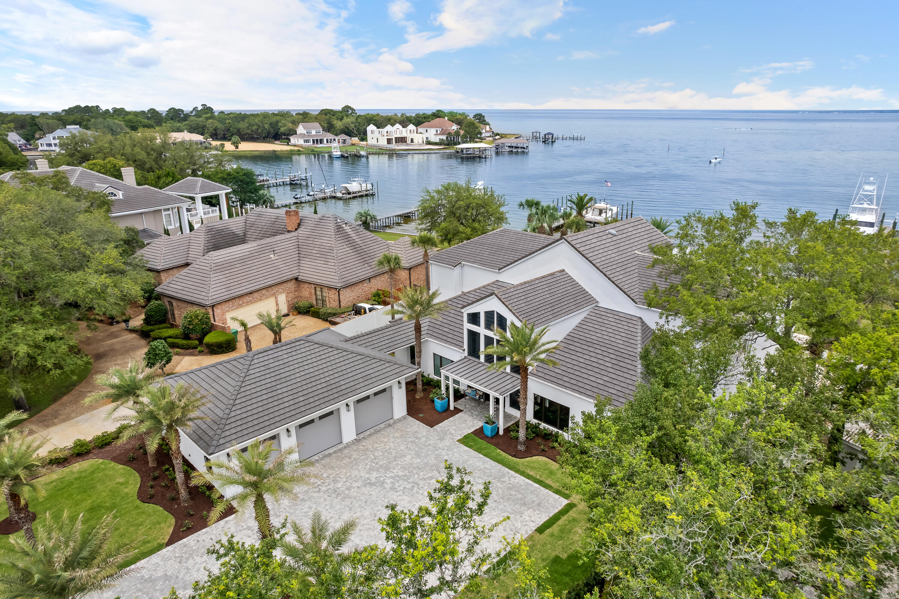 *** Luxury Deepwater Estate ***Located in Indian Bayou with .75 Acres and 138' of scenic waterfront views of the Choctawhatchee Bay. This luxurious home of 6100SF offers over $600,000 of upgrades (2021-2024) to bring this 4bedroom 5 bath a must see! Outside the home, a NEW TILE ROOF(March 2024), Leaf Filter Gutter Guards, all New Landscaping including a new front Bermuda Lawn, New Irrigation, New Landscaping Lighting, New paver driveway, a New oversized 3 Car Garage attached by a Breezeway to the main residence, a New 81KW Generac in Home Generator, New Summer Kitchen with Natural Gas Grille, Ice Maker, Refrigerator. For relaxing afternoons or weekend pool parties you will enjoy.