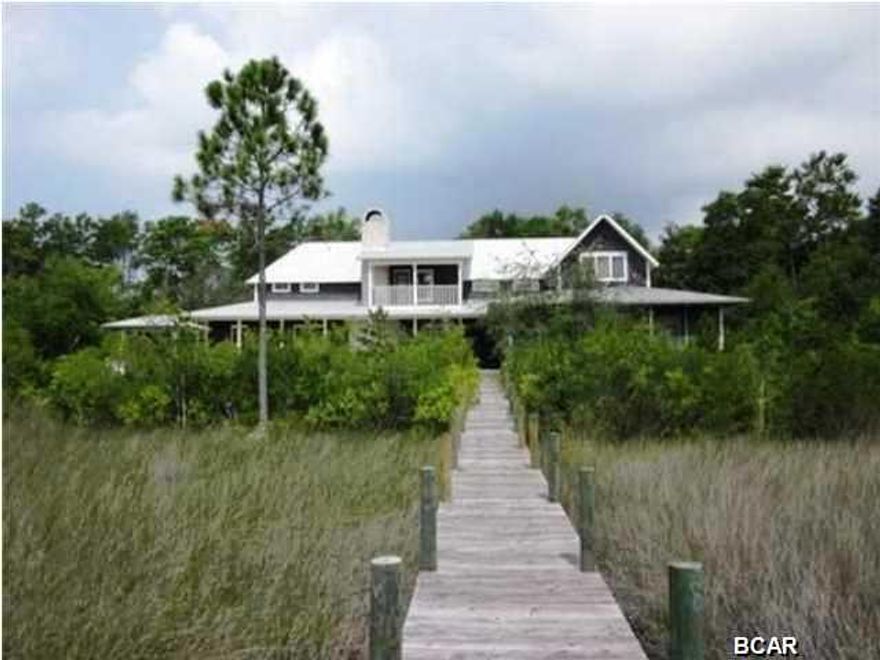 This Spacious Waterfront Home in Historic Point Washington is a must see. The 5 bedroom, four and a half bath home features hardwood floors, Cathedral ceilings, walk in closets, walk in shower and garden tub. 150 feet of water frontage with beautiful views of the deep water Peach Creek and beyond. Salt water pool, hot tub and a boat slip are but a few of the amenities. Dimensions are approximate. Please verify if important.