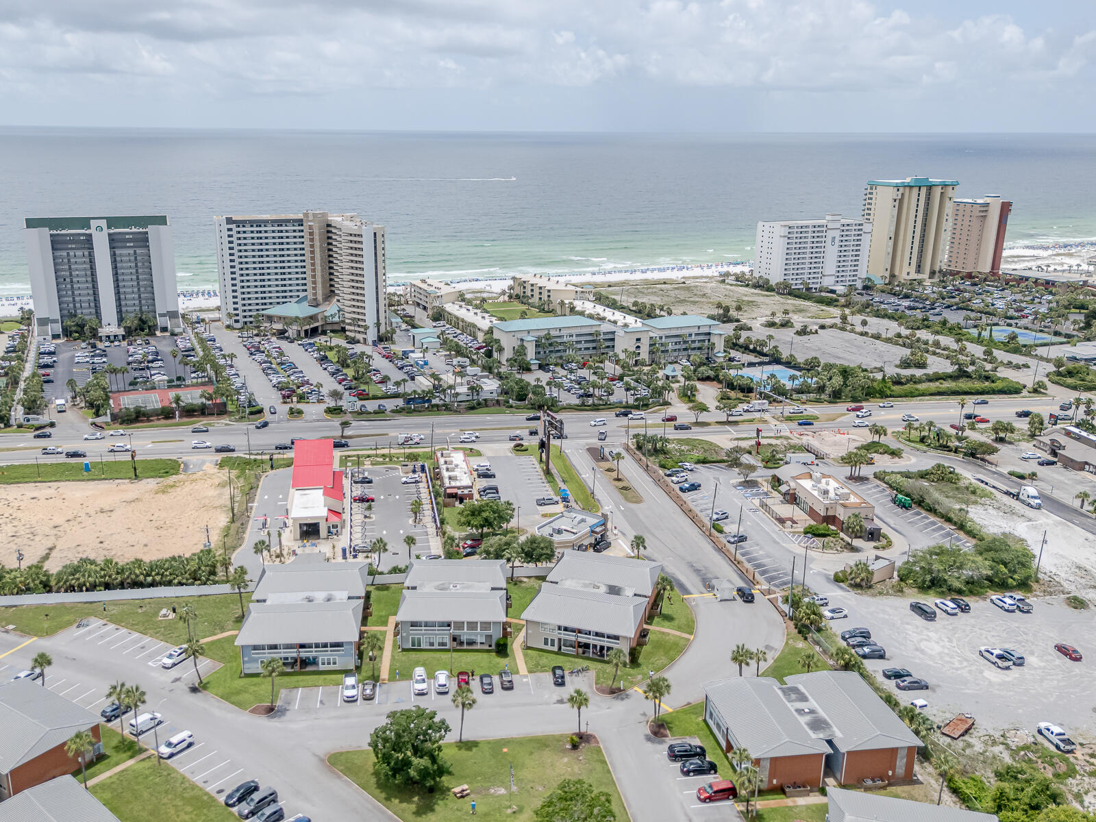 Destin 2BR 1BA Clean and Spacious Condominium located on the first-floor next to one of the pools presents a fantastic investment opportunity, NO RENTAL RESTRICTIONS, allowing for flexible income potential. Condo is remodeled, new HVAC, new Water Heater, copper wiring, modern ceiling fans, smart TV's, stainless steel appliances, laundry room. Pet Friendly Community, No Flood Zone! Sold Furnished, sleeps 7 guestCommunity Features: gated entrances from HWY 98 and Airport Rd, Access to 3 swimming pools, Tennis / Pickleball court, EV chargers and a clubhouse for owners. HOA Coverage: The monthly fee covers building insurance and exterior maintenance, water, internet, sewer, trash, landscaping, and maintenance of pools and gates, ensuring low maintenance for the homeowner. See More Section The condo is furnished King size Bed, queen size bed and twin bunk beds. Complex has BBQ/Picnic areas, abundance of green spaces, ample free parking, remodeled pools & bathrooms. No special assessments.