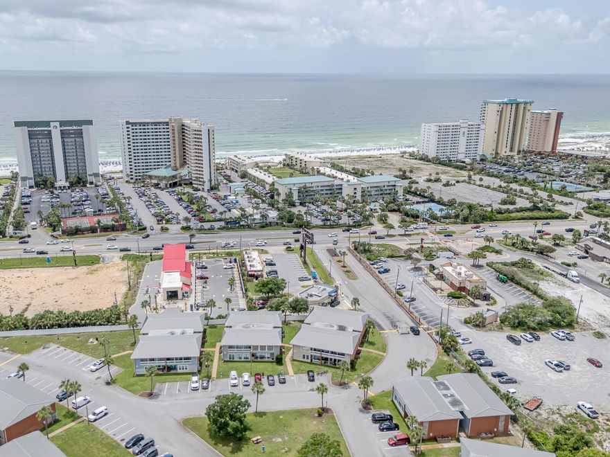 Destin 2BR 1BA Clean and Spacious Condominium located in Gulf Terrace, on the first-floor next to one of the pools  NO RENTAL RESTRICTIONS, allowing for flexible income potential. Condo is remodeled, new HVAC, new Water Heater, copper wiring, modern ceiling fans, smart TV's, stainless steel appliances, laundry room. Pet Friendly Community, No Flood Zone! Sold Furnished, sleeps 7 guests. COMPLEX IS APPROVED FOR VA FINANCING.Community Features: gated entrances from HWY 98 and Airport Rd, Access to 3 swimming pools, Tennis / Pickleball court, EV chargers and a clubhouse for owners. HOA Coverage: The monthly fee covers building insurance and exterior maintenance, water, internet, sewer, trash, landscaping, and maintenance of pools and gates, ensuring low maintenance for the homeowner. The condo is furnished King size Bed, queen size bed and twin bunk beds. Complex has BBQ/Picnic areas, abundance of green spaces, ample free parking, remodeled pools & bathrooms. No special assessments.  