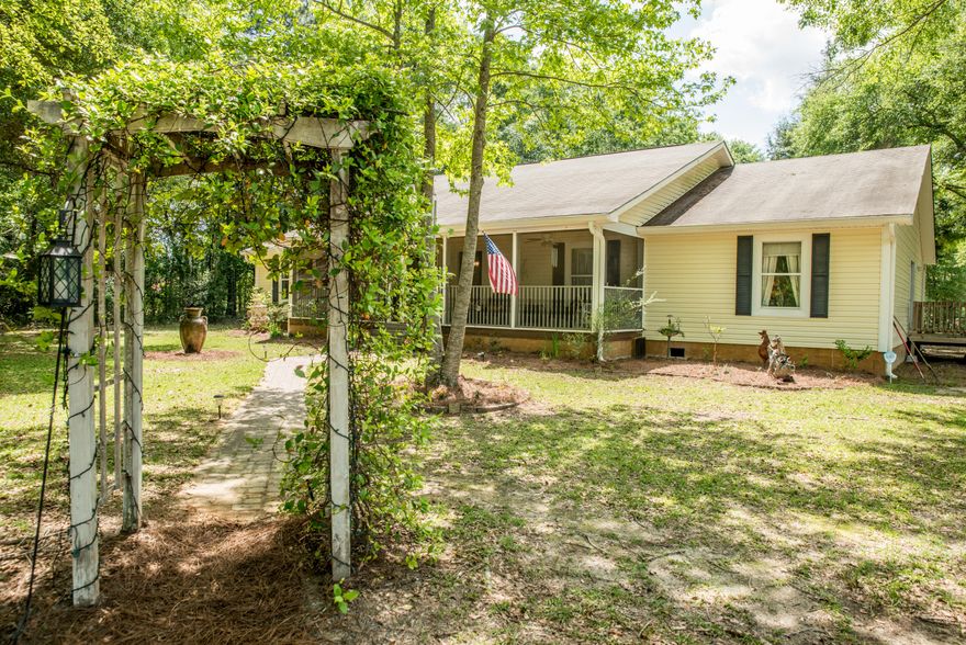 Welcome to your country Oasis. This private retreat sits on 15.5 acres with a beautiful home & separate MIL suite and workshop below. It is convenient to a great school & stores. Secluded, but located near highways, and only 45 minutes to the beach! Pensacola, PC and Destin are all within an hour! Love Scuba? Bring your scuba gear to this country estate, and enjoy three local natural springs. You even have your own spring-tapped well for the home! Hunters will love the Food plot and deer stand. Drive up the long driveway with beautiful, large grassed yard lined with Live Oak trees. Pass through the arbor and in though the screened porch, open the doors to custom, sawmill hardwood floors, walls and ceiling! Unique interiors, tongue and groove walls with a Chip & JoAnna vibe!