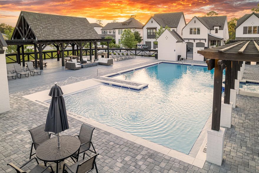 Step into refined coastal living with the Normandy floor plan at Ridgewalk, a French inspired masterpiece designed with timeless style and modern luxury. This home is beautifully appointed with shiplap detailing throughout, hardwood floors, and custom designer finishes. The open concept gourmet kitchen is a true showpiece, featuring a walk in pantry with floating shelves and a beverage refrigerator, along with premium appliances and natural gas for cooking. A pocket office adds convenience for today's lifestyle, while spacious living area flow seamlessly to the outdoors, where a built in summer kitchen awaits for effortless entertaining. The master suite is a private retreat, offering a spa like bath and an expansive walk in closet. Seller to extend builder's home warranty at contract.