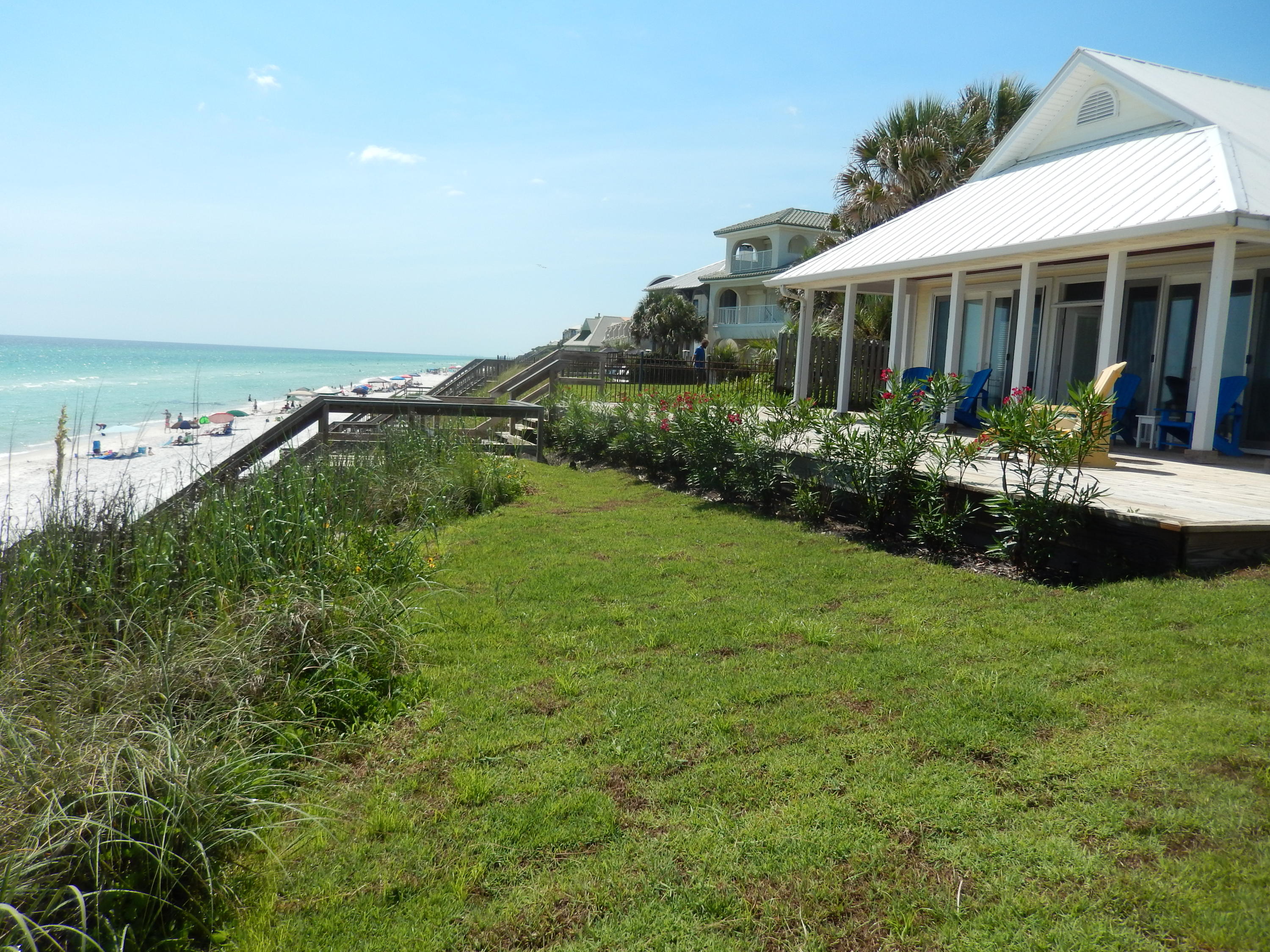 Gulf Front Florida Cottage with Seawall, and 78' on the Beach in Seacrest community near Rosemary Beach, Florida on Scenic 30A! Zoned Infill (develop multiple units or split lots). Main House on Gulf has 4 bedrooms, 31/2 Baths, appx. 2,200 sq. ft. on one level, with large inground Pool between main house and 3-Story two bedroom, 2 1/2 Bath Guest House. Beautiful Property, 2 houses, with landscaping and palms. Gulf side of the main house has all new glass doors and windows; gulf front master bedroom with doors opening to porch and gulf. Covered porch with huge deck and eating area on gulf side. Outdoor Shower plus a breezeway at rear entrance of house. This property is a large parcel-park boats,RV; 2005 Survey, List of Exceptions (mostly art), and Recent Improvements are in ''Documents''