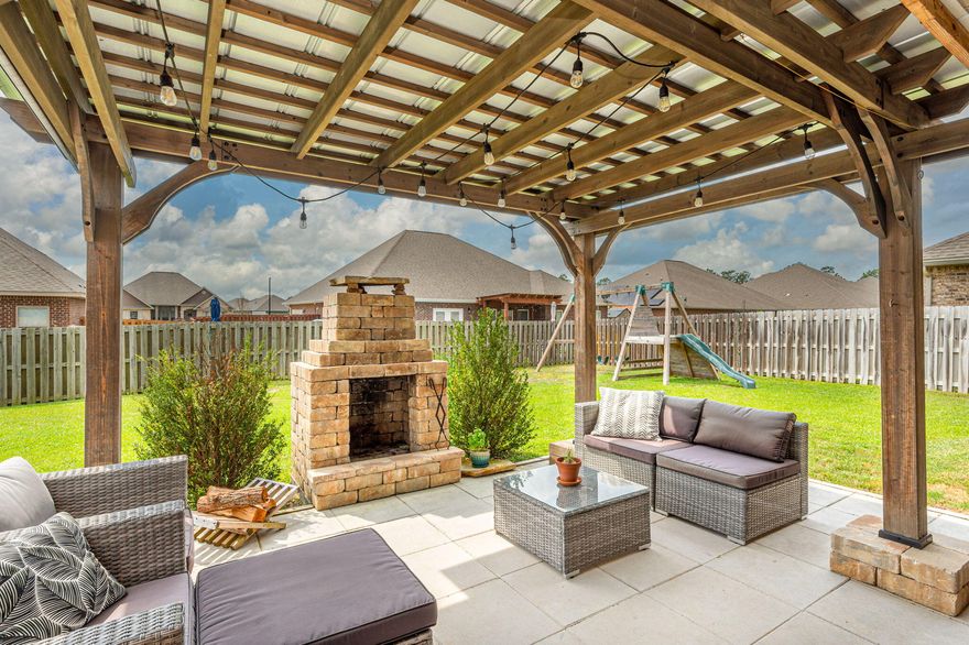 PRICE IMPROVEMENT on this lovely home!! Check out this beautiful 4 bd/2.5 ba split bedroom floor plan w/ open concept and 9' ceilings throughout. Spacious living room features a double trayed ceiling. Kitchen boasts a center island, granite countertops, nice pantry with custom stained wooden shelving and adjacent dining area. The master suite has a single trayed ceiling and master bath has a garden tub, separate tiled shower, double vanity w/ granite countertops and walk-in closet. Additional bedrooms are all a nice size; guest bathroom features dual vanity sinks; super cute laundry room; 1/2 bath for guests; a 19 ft covered patio; large front porch. Awesome pergola space off the covered back patio w/ outdoor stone fireplace and privacy fenced in backyard. Fantastic subdivision amenities