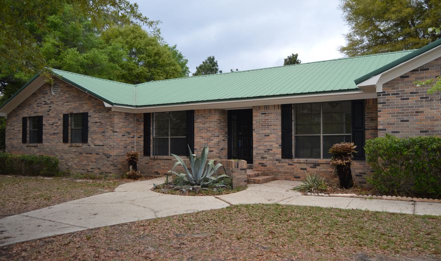 Welcome home! If you are in search of peaceful country living with tons of bonuses...look no further. This beautiful brick 4 bed/3bath REO home rests on 2.5 acres of land with a screened in pool to enjoy on those hot summer days. It has been renovated to include NEW paint throughout, NEW countertops in kitchen and baths, NEW dishwasher and stove, NEW tile floors in several rooms and much more. If that isn't enough, it also has an oversized detached garage with workshop and addtional storage rooms. Don't miss out on this great opportunity. Make your appointment today!
